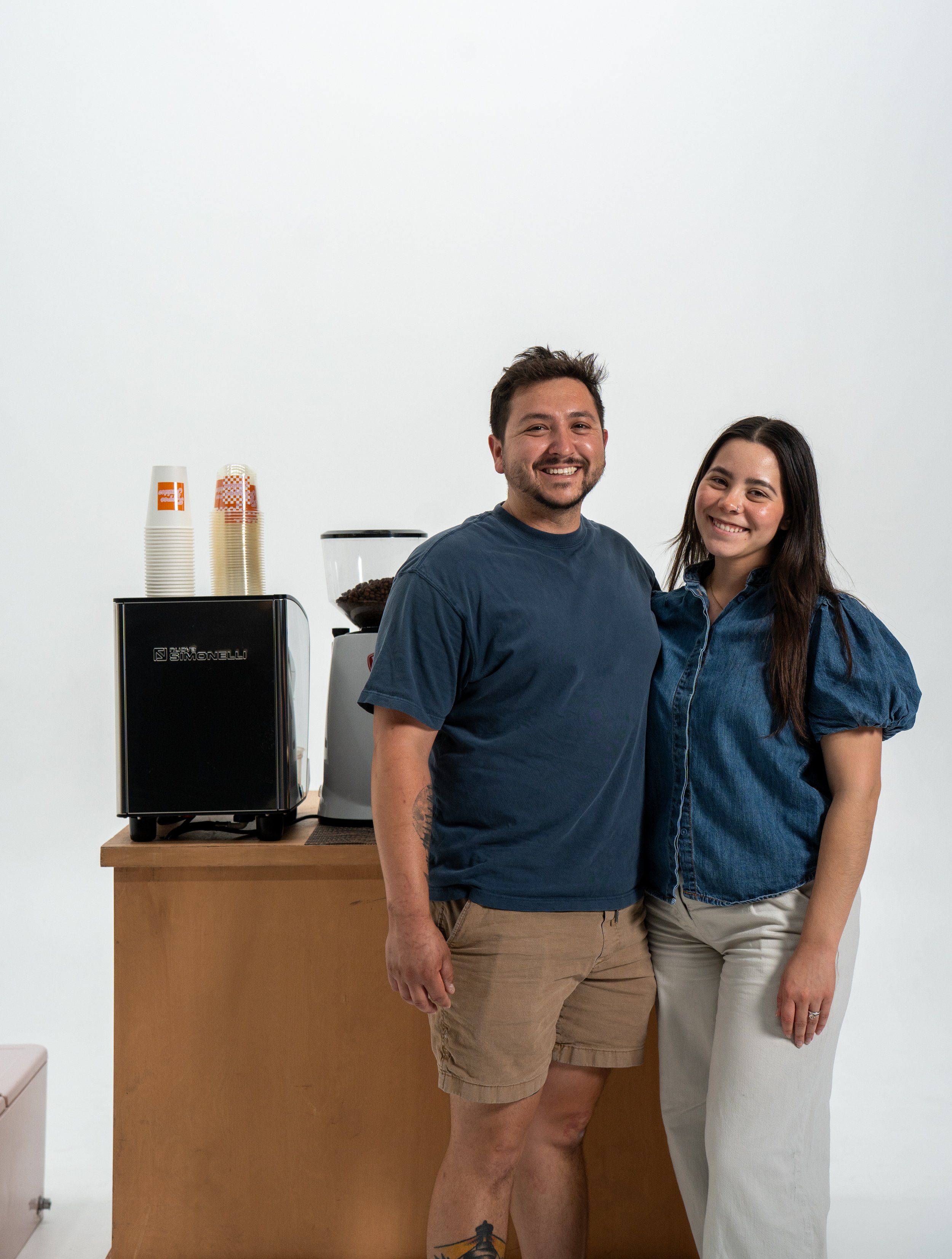couple standing in front of an espresso cart, mobile coffee southern california, mobile espresso bar orange county, socal coffee cart, oc matcha catering, anaheim matcha bar