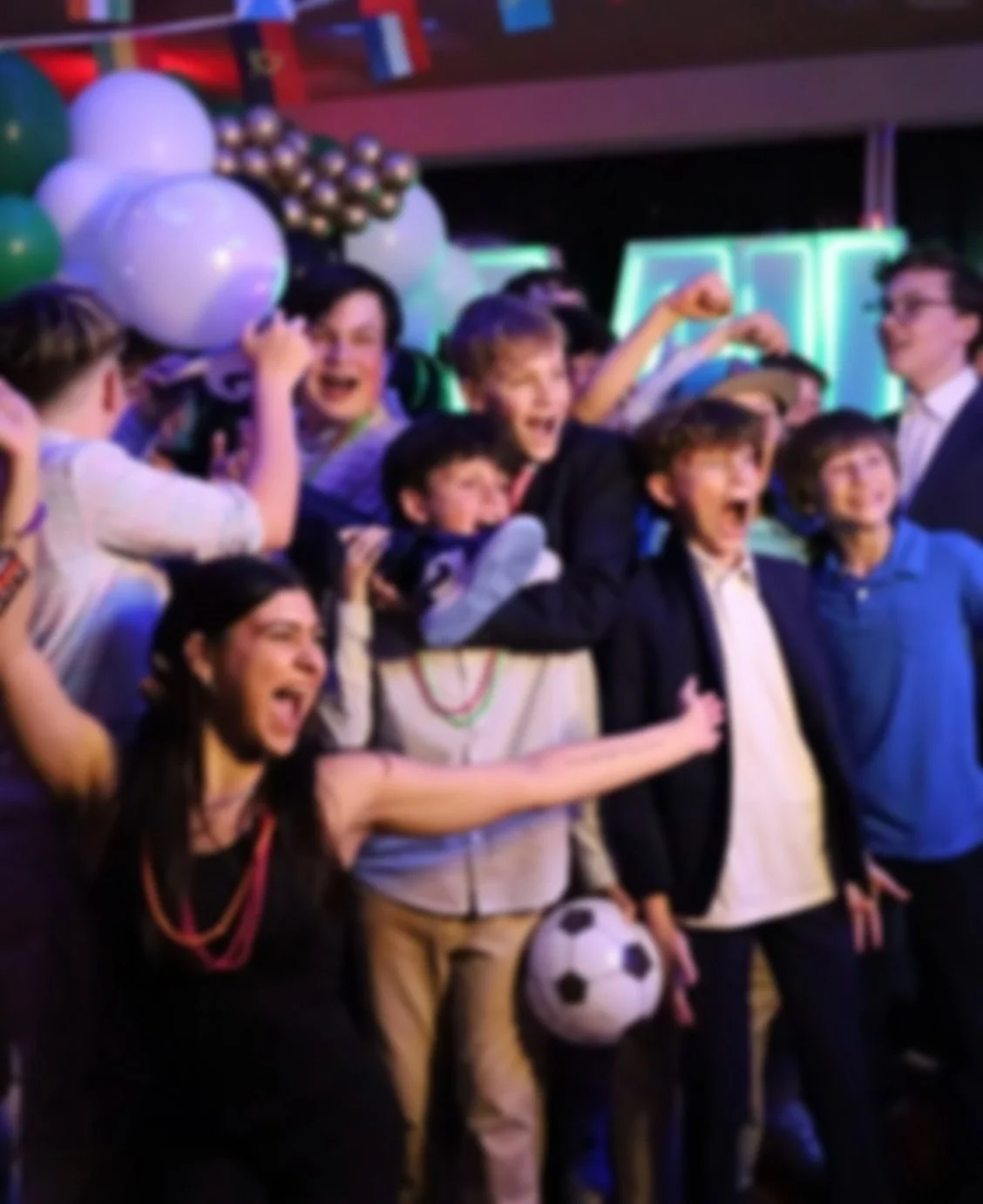 Soccer-themed Bar Mitzvah decor with balloons, international flags, and custom sports party details in Boston.
