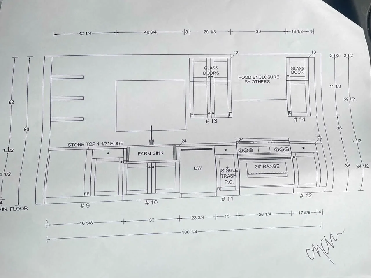 A detailed kitchen layout plan with measurements, including areas for a farm sink, dishwasher, stove, and glass door cabinets, with notes about hood enclosure and stone countertop edges.