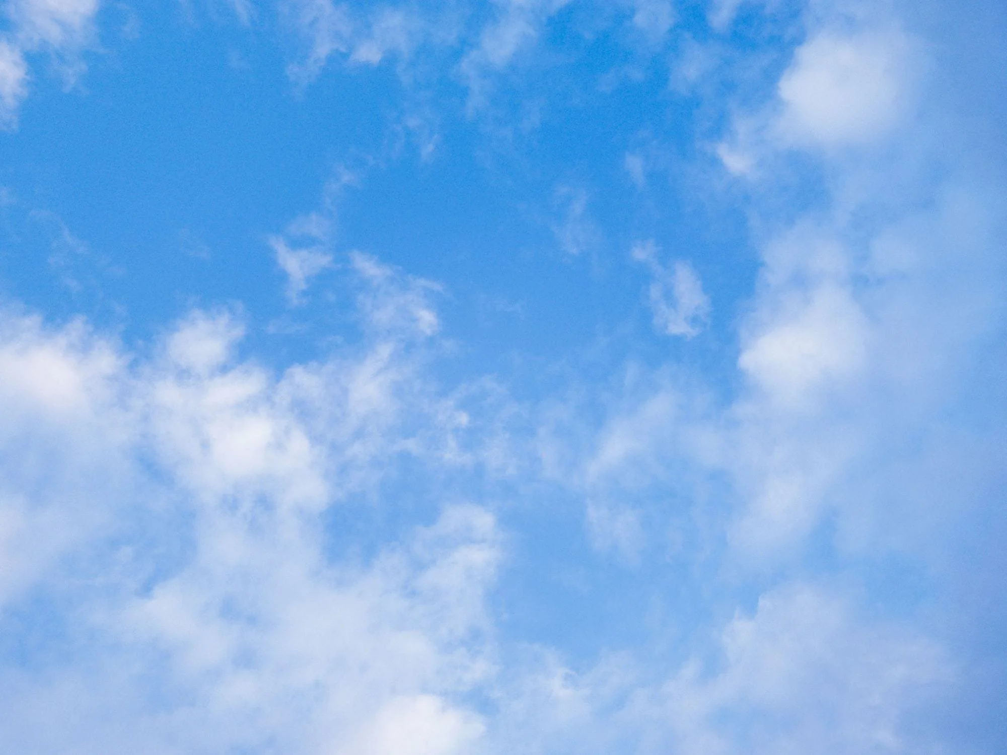 Open sky with clouds and abstract kites flying