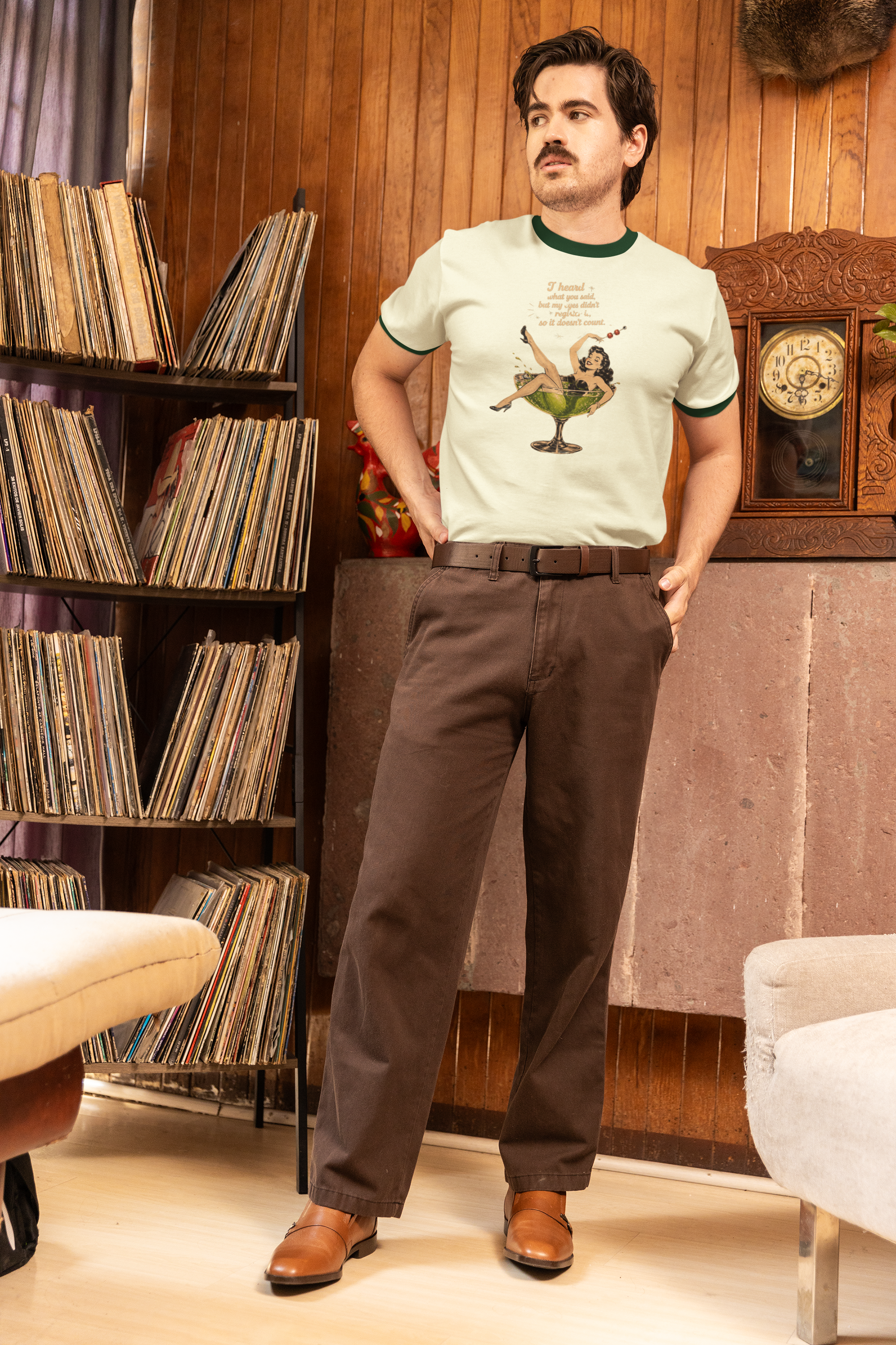 ringer-t-shirt-mockup-featuring-a-man-posing-in-a-retro-room-with-a-grandpacore-outfit-m40648.png