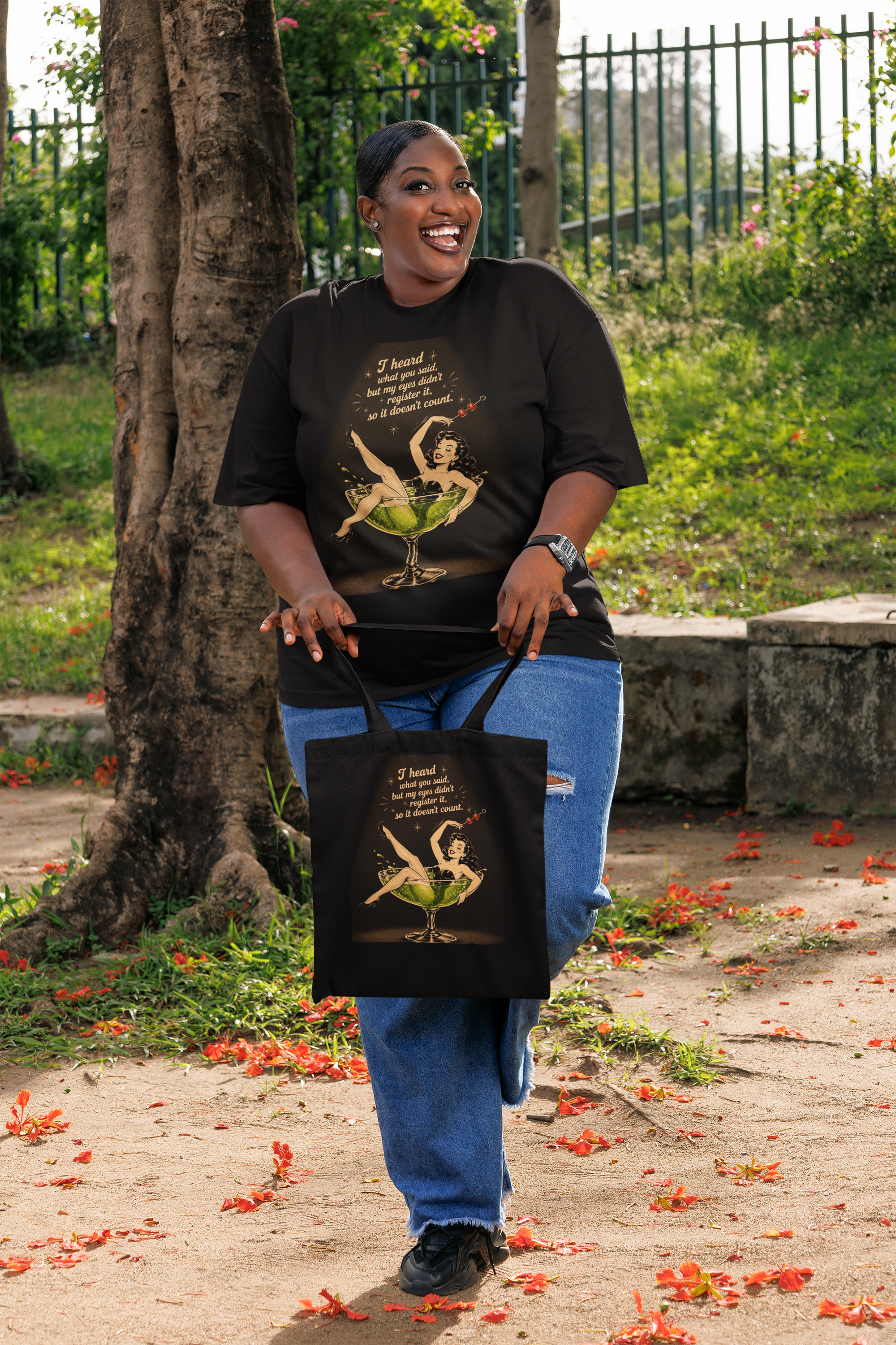 oversized-t-shirt-mockup-featuring-a-cheerful-woman-holding-a-sublimated-tote-bag-m56949.png