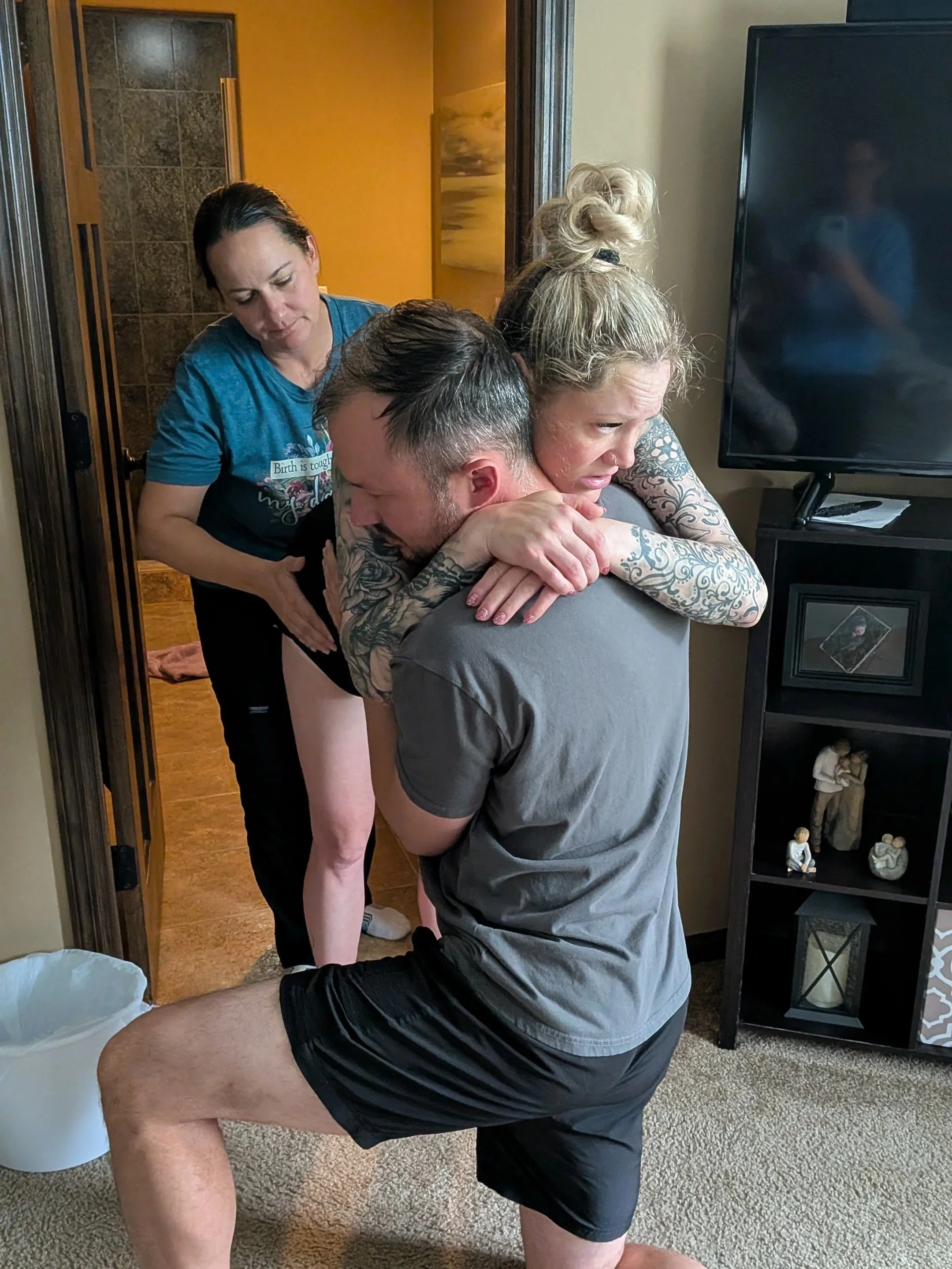 Terri Schelkoph Twin Cities birth doula guiding a family through prenatal movement and birth preparation