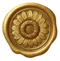 Close-up of a gold-colored wax seal with a floral design.