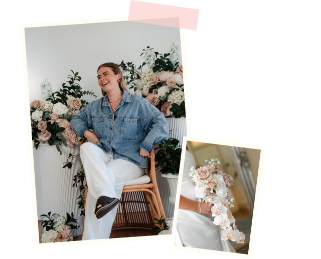A woman in a denim jacket and white pants sitting on a wooden chair, smiling, surrounded by floral arrangements with roses and greenery.