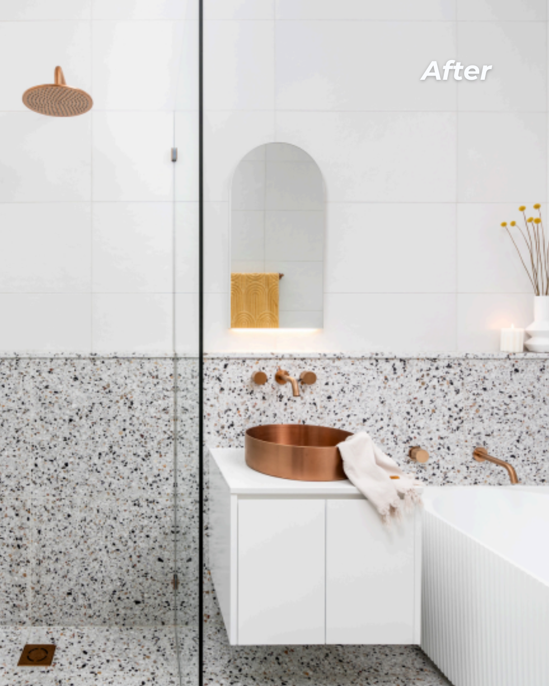 A modern bathroom with a terrazzo countertop, copper sink, and wall-mounted copper faucet. A white cabinet with a towel, a gold-rimmed mirror, and a vase with yellow flowers are visible. The word 'After' is written in the top right corner.