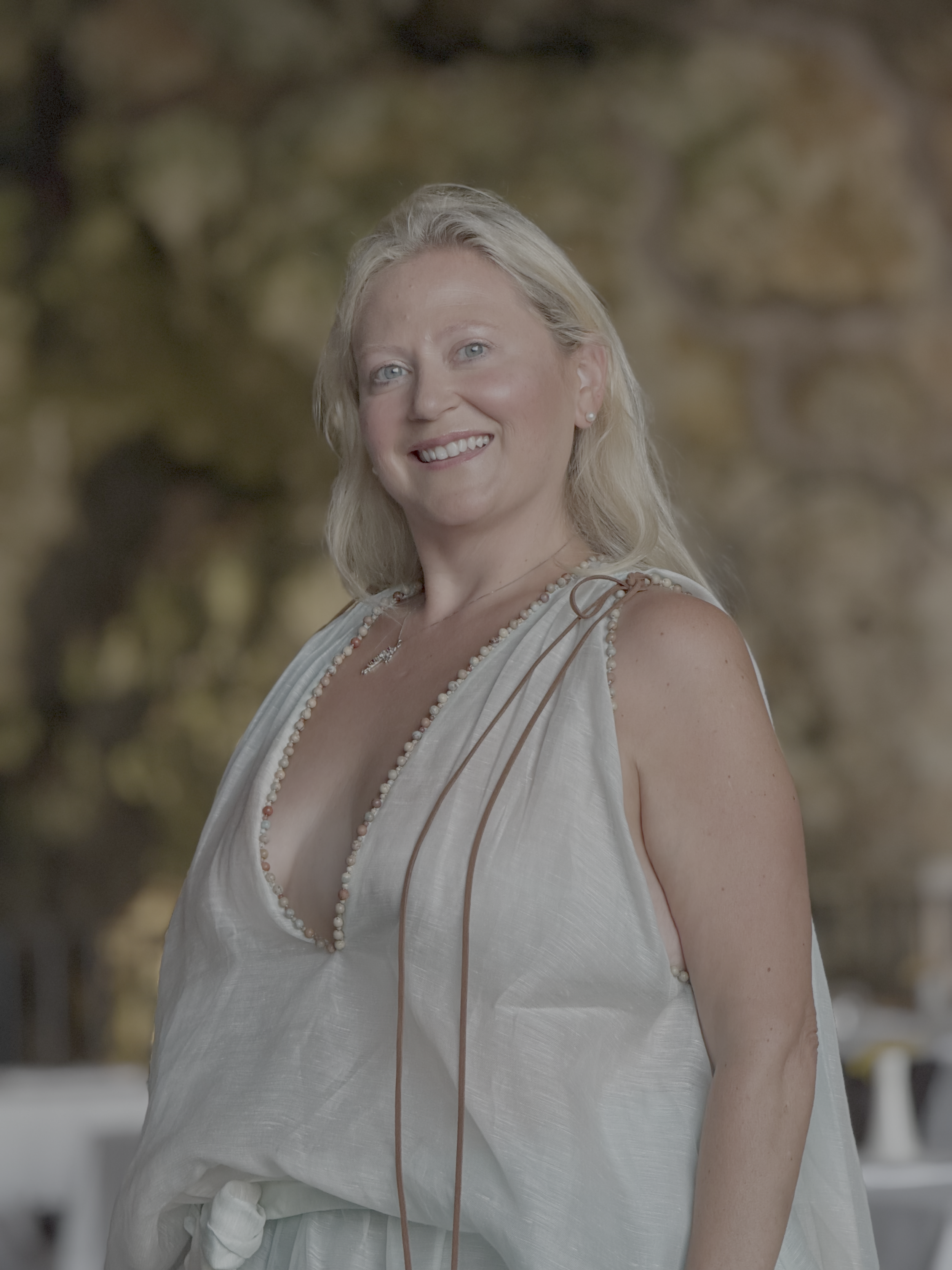 woman in beautiful dress in scenic grotto in italy