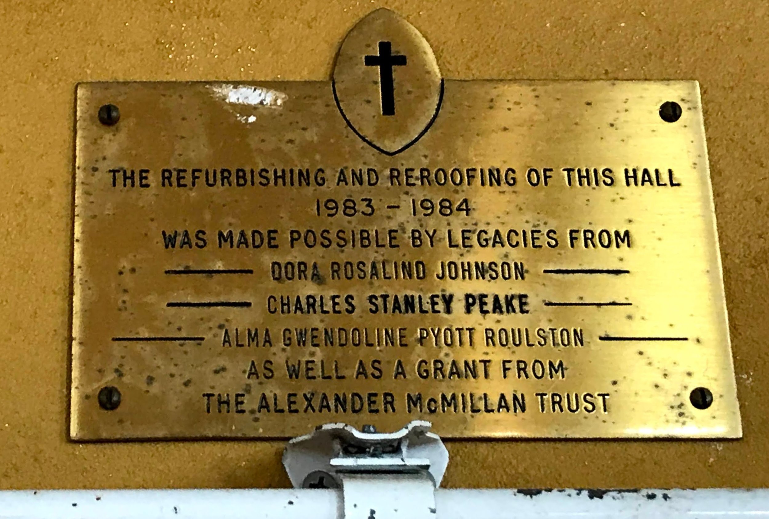 Plaque revealing details of a re-roofing project in 1983-84