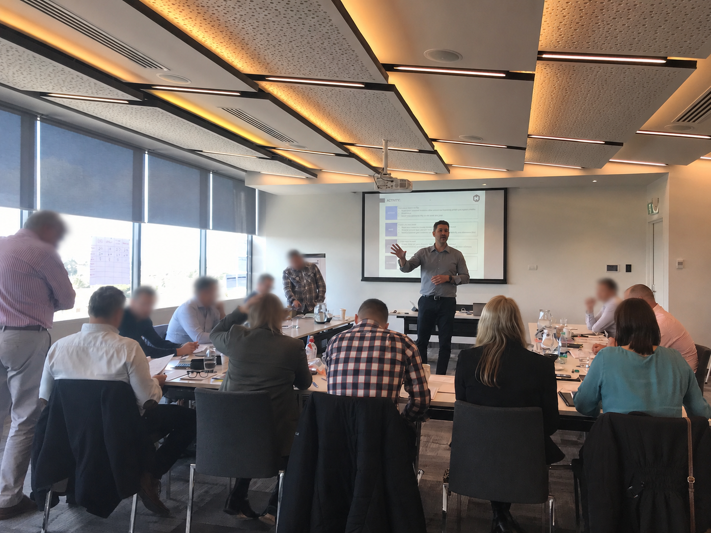 Senior industry practitioner facilitating a Commercial Academy session