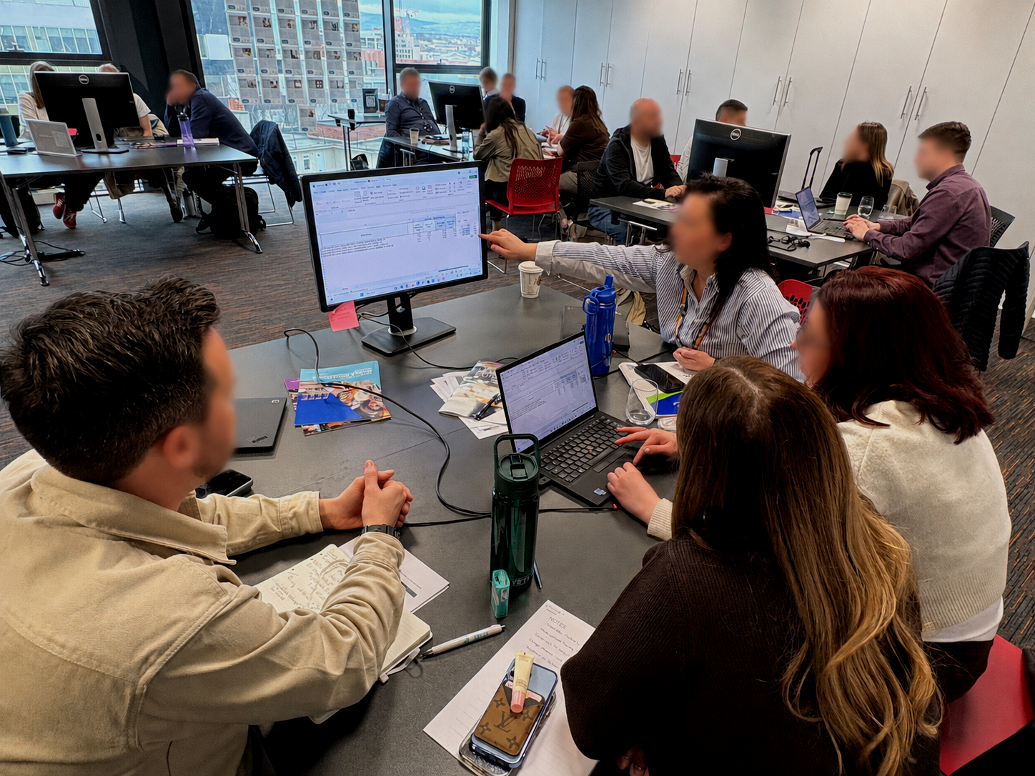 Participants running a retail business in the Retail Immersion commercial simulation