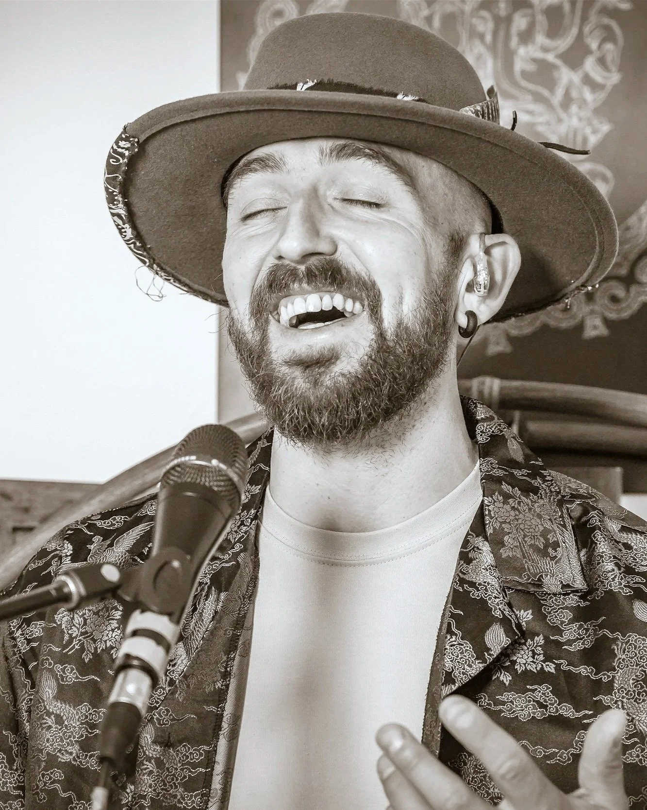 Kane Rogerson performing live vocals during an ambient meditation music session.”