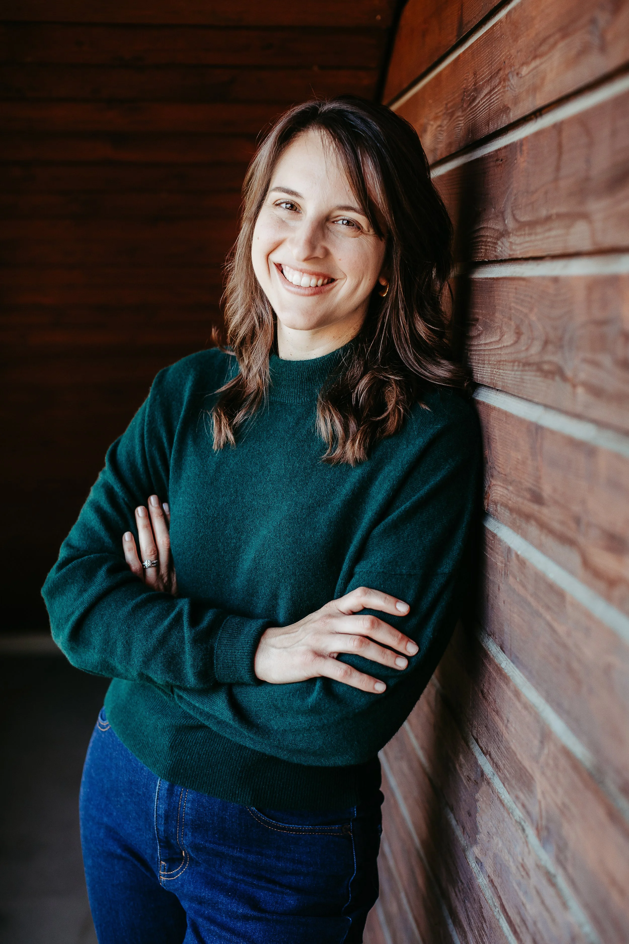Picture of Kara leaning against a wall and smiling at the camera