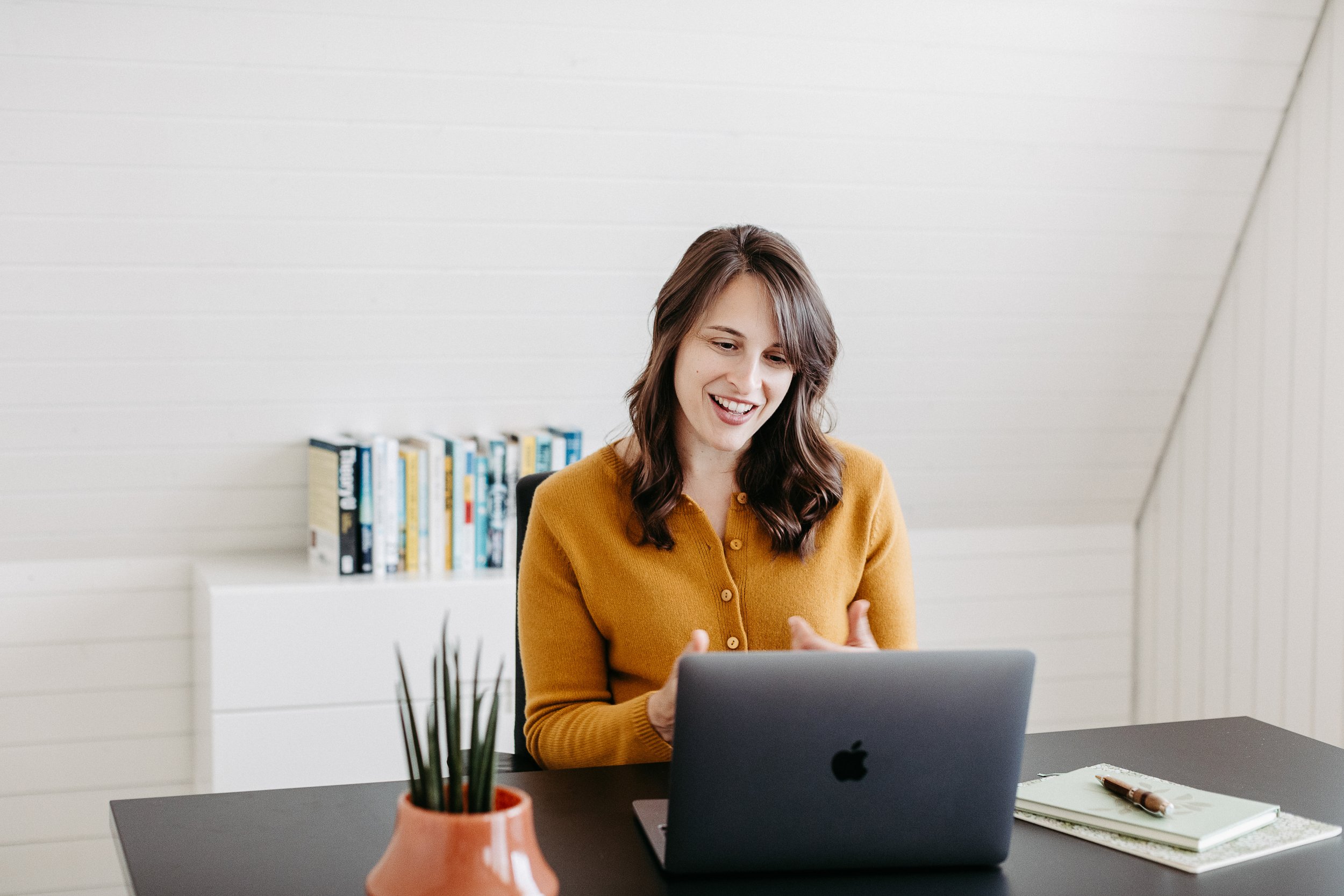 Image of Kara in her office, speaking to a coachee via her laptop