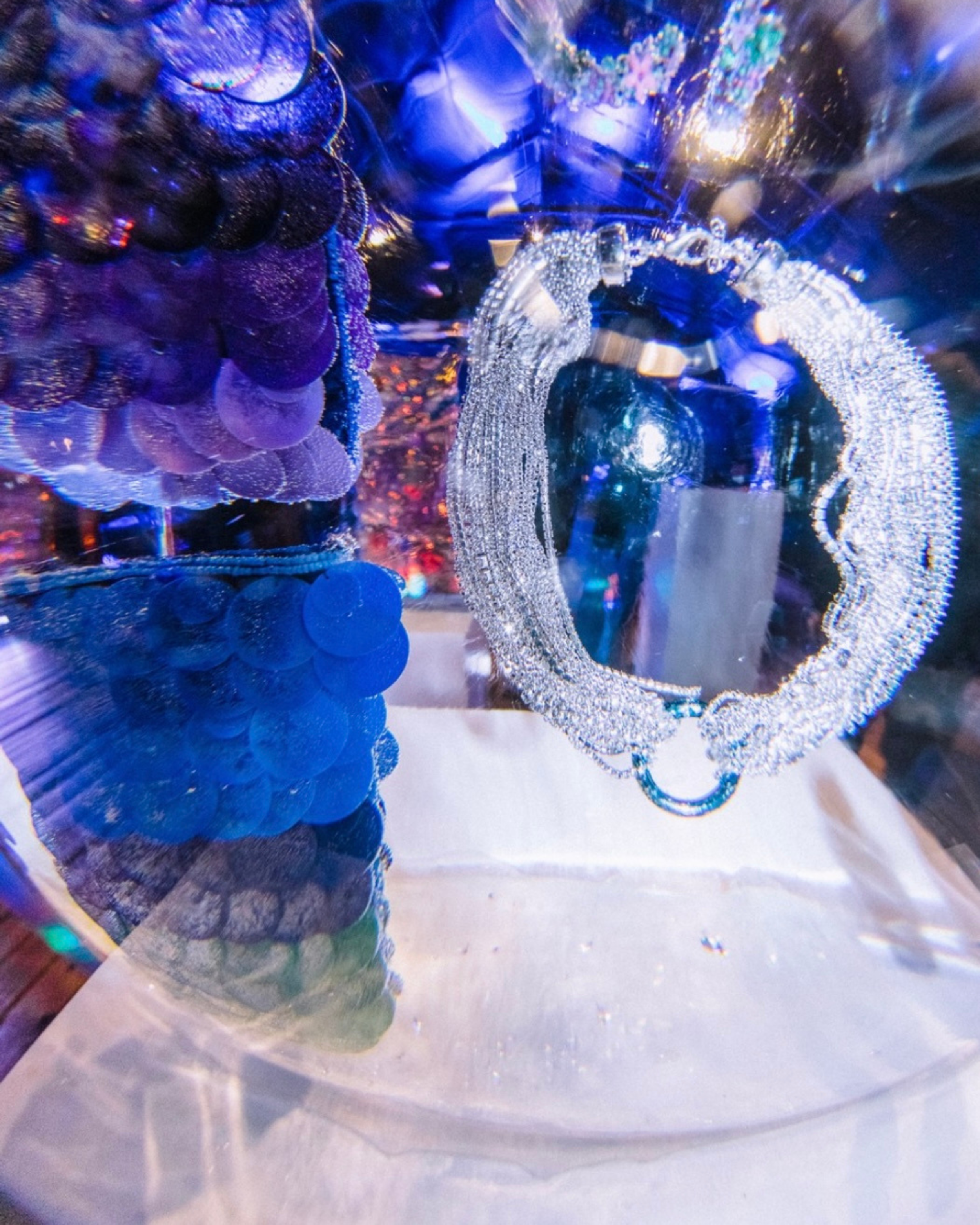 Accessories showcased inside custom ice installations.