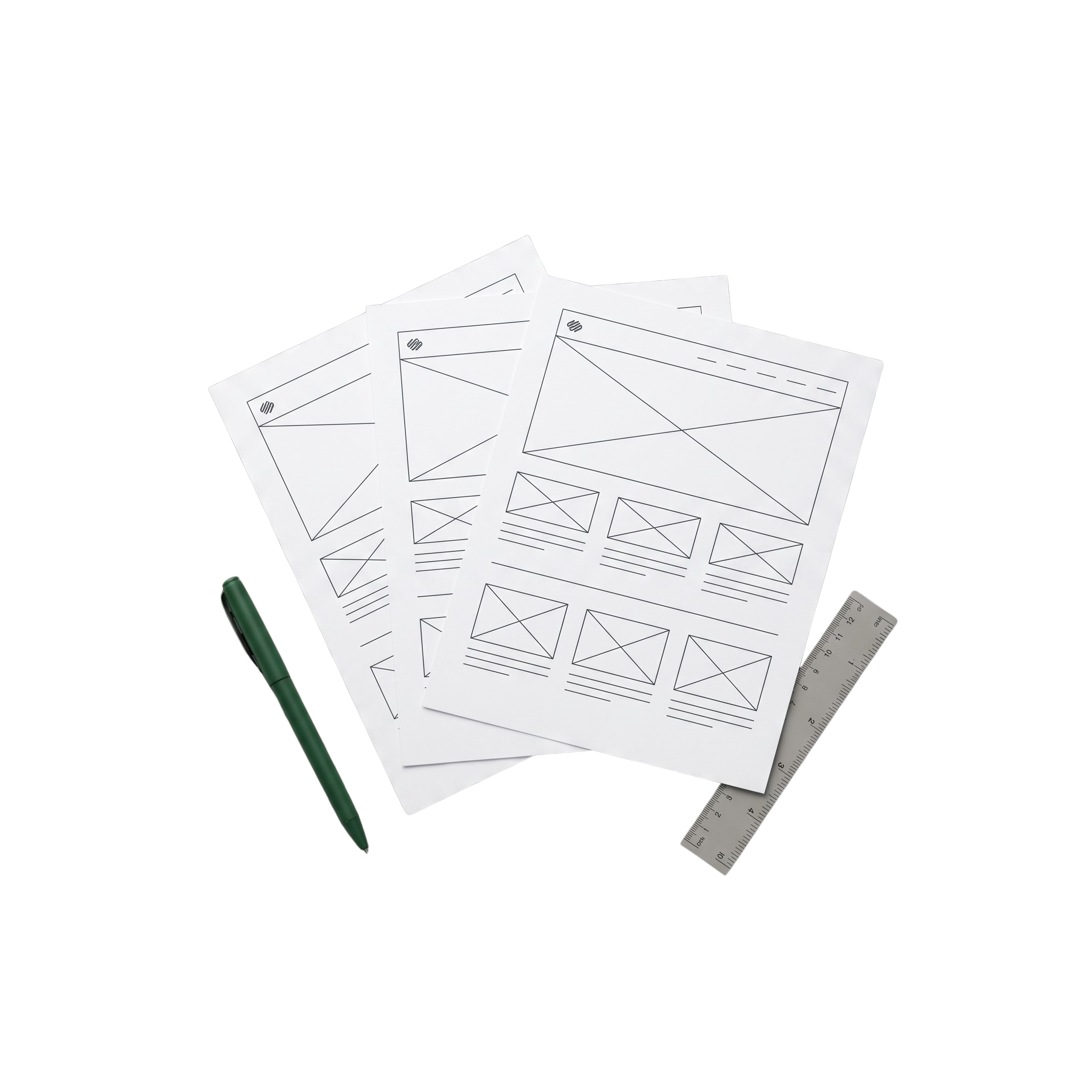 Several sheets of paper with wireframe website design sketches, a green pen, a ruler, and a small green cylindrical object on a black background.