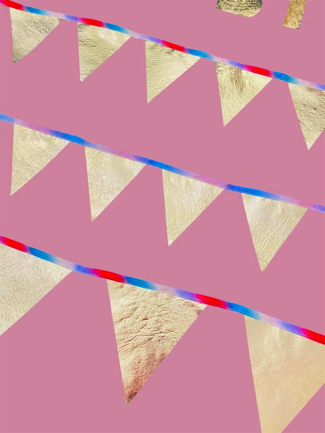 Decorative gold bunting with rainbow strings between them.