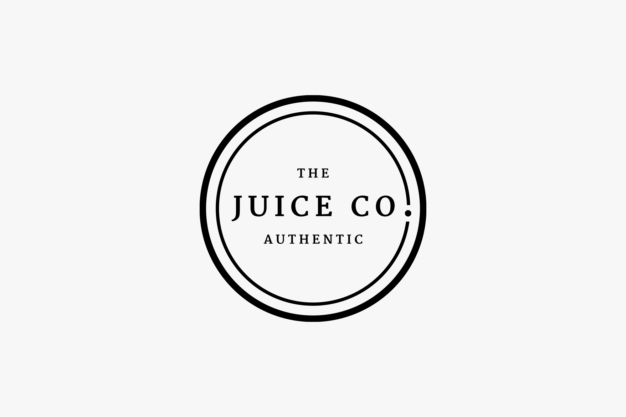 Black and white logo of The Juice Co with the words 'The Juice Co. Authentic' inside a circular border.