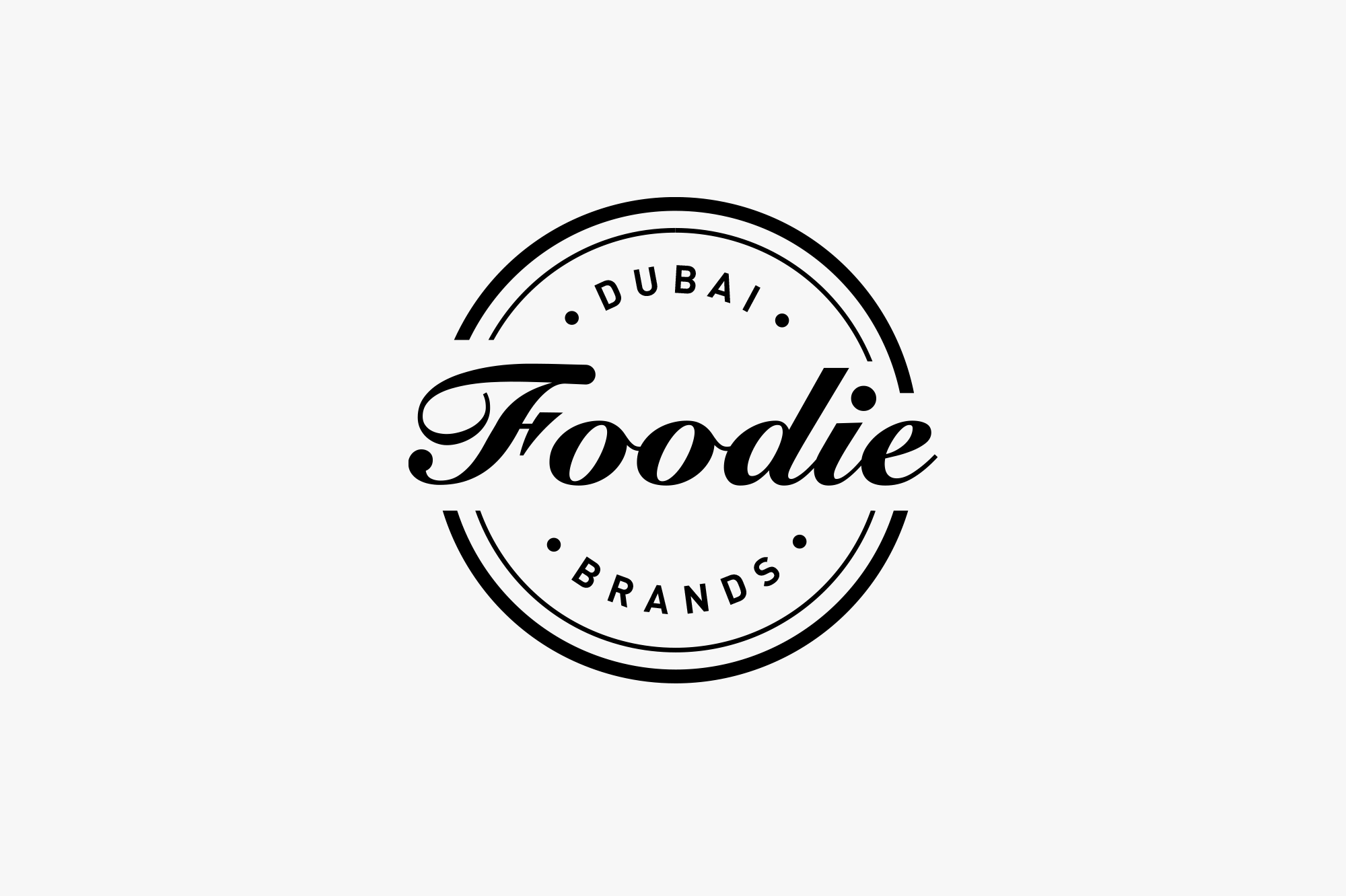 Black and white logo for 'Foodie Dubai Brands' with a circular design and stylized text.