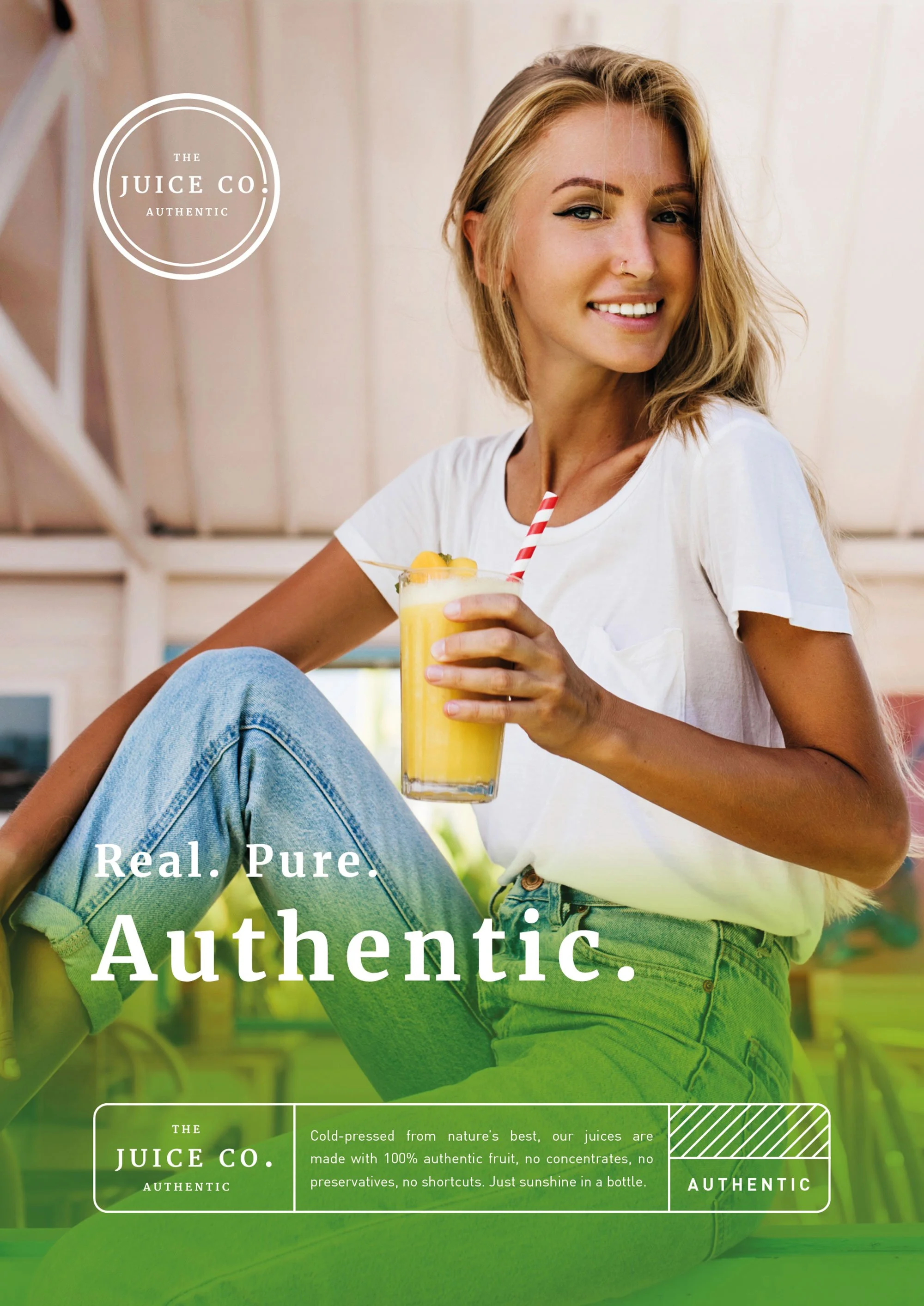 A young woman with blonde hair, wearing a white t-shirt and jeans, is sitting and smiling while holding a glass of orange juice with a striped straw. The background appears to be a bright, indoor space. The image is part of an advertisement for The J