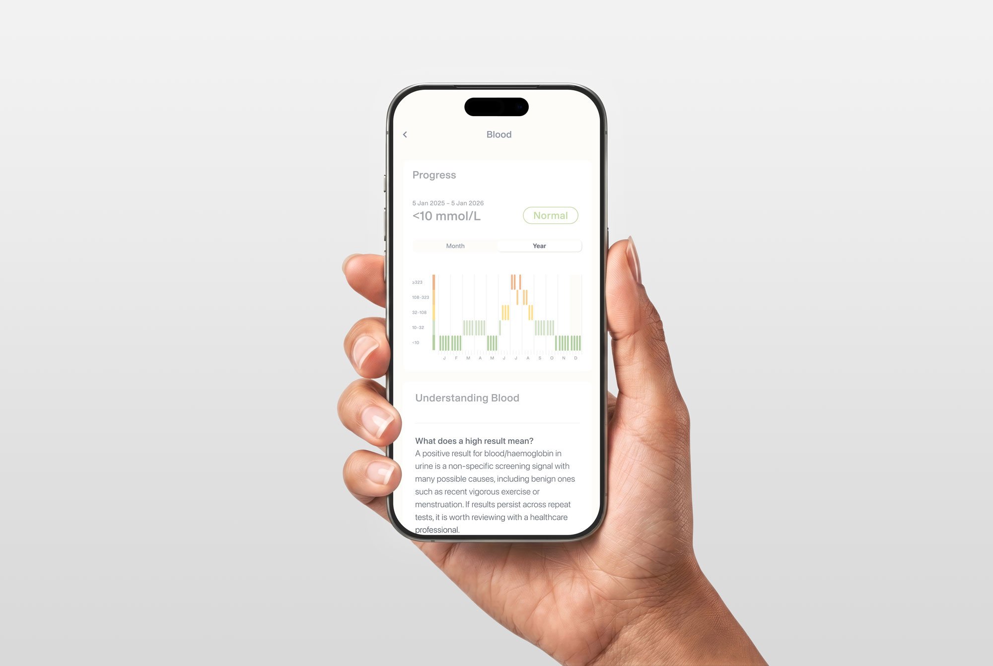 Close-up of a hand holding a smartphone displaying a health app with blood test results and a graph.