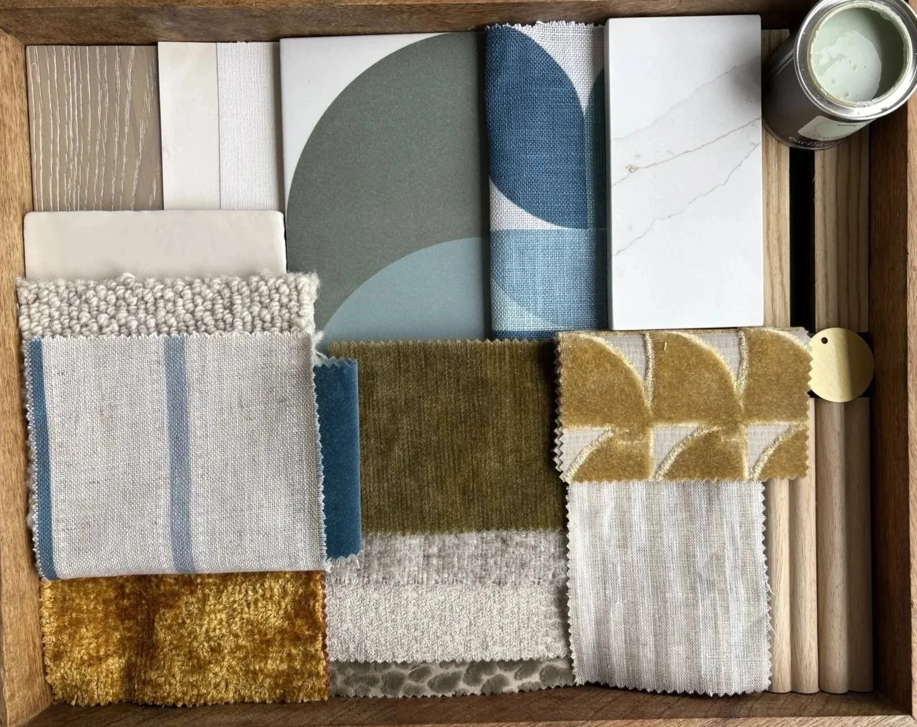 Cohesive interior design finishes board showing a coordinated colour palette, surface finishes, materials, textures and tones