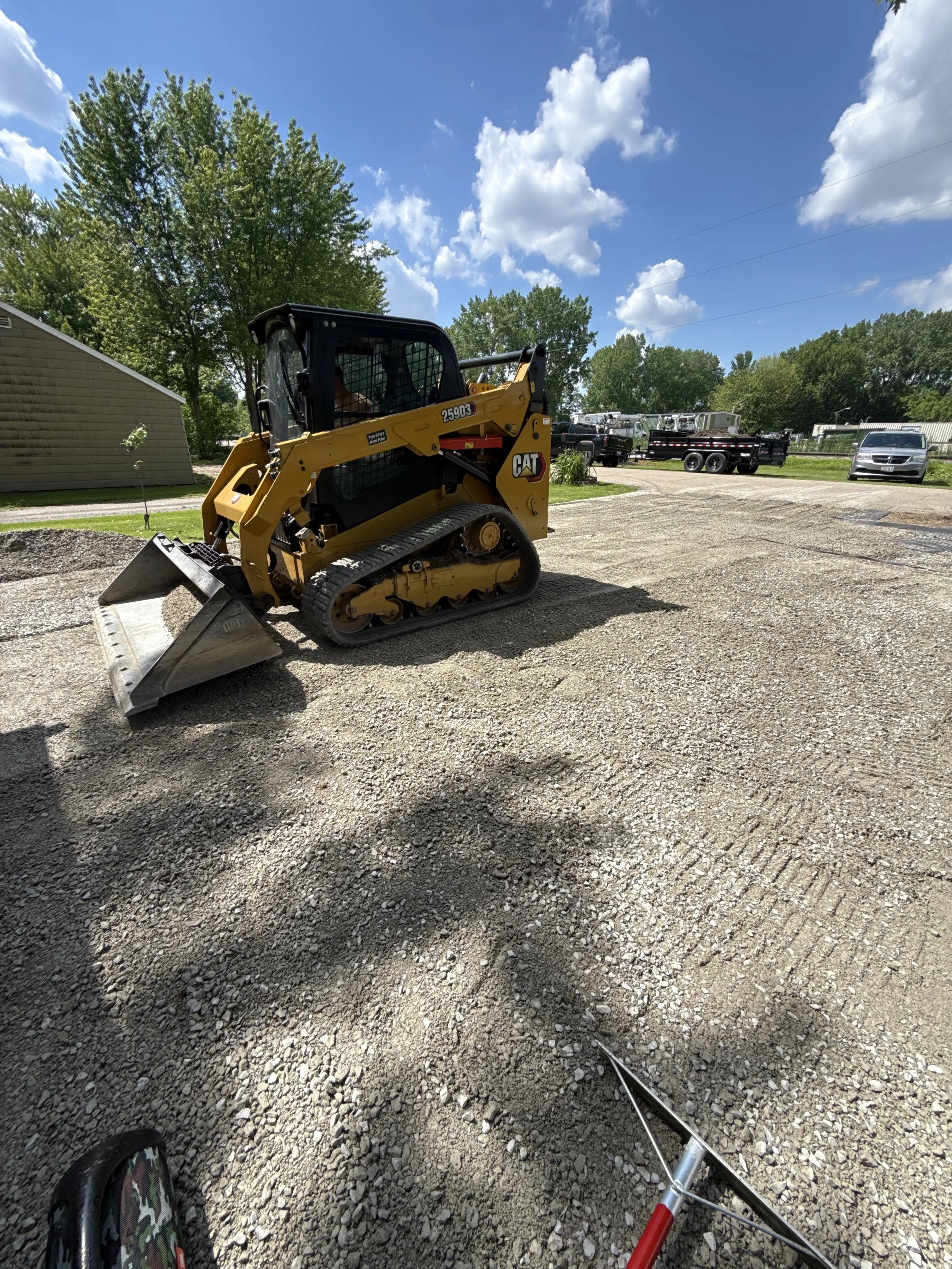 Fixing Gravel Driveway potholes and weed overgrowth in Menasha, Wisconsin.