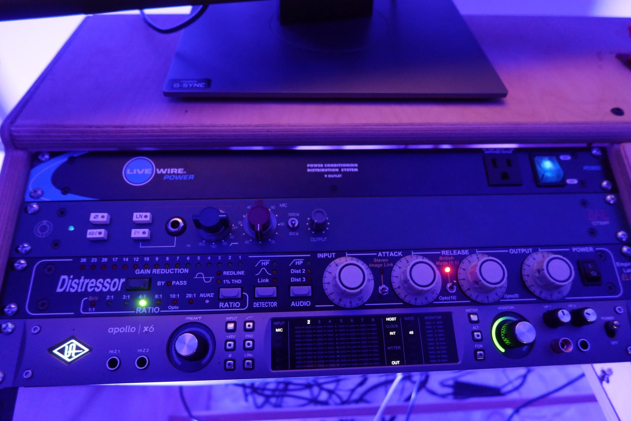BLNDMAN Records rack-mounted recording equipment under blue studio lighting