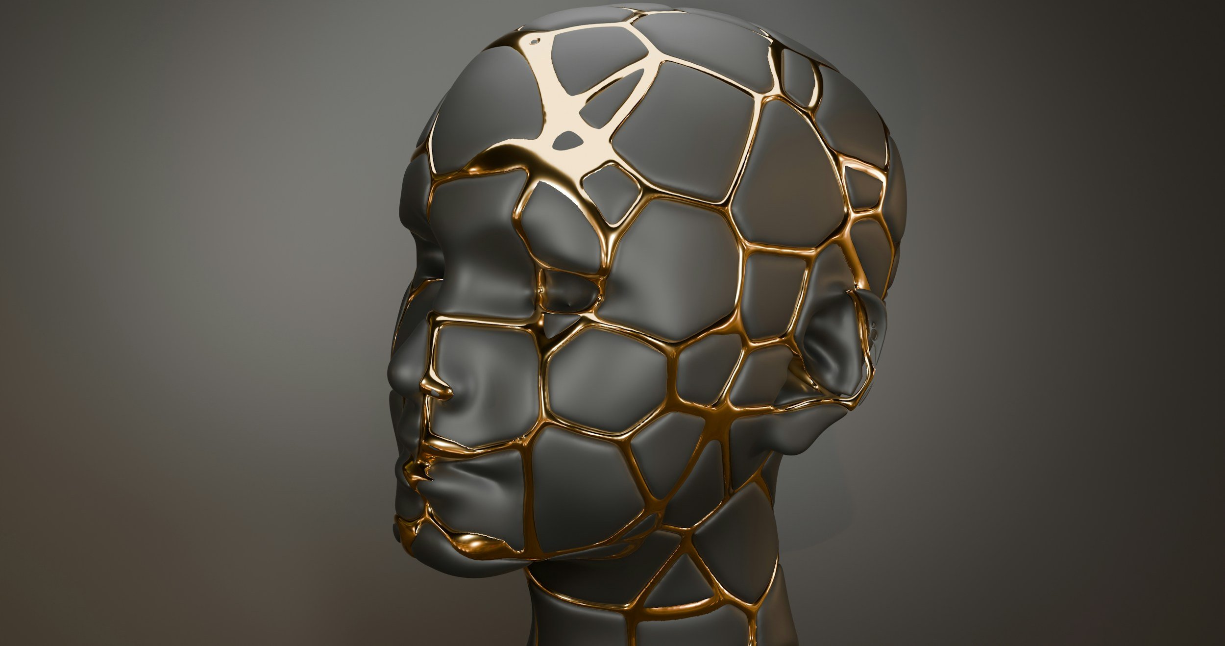 Minimal grey human face sculpture with golden kintsugi-inspired lines