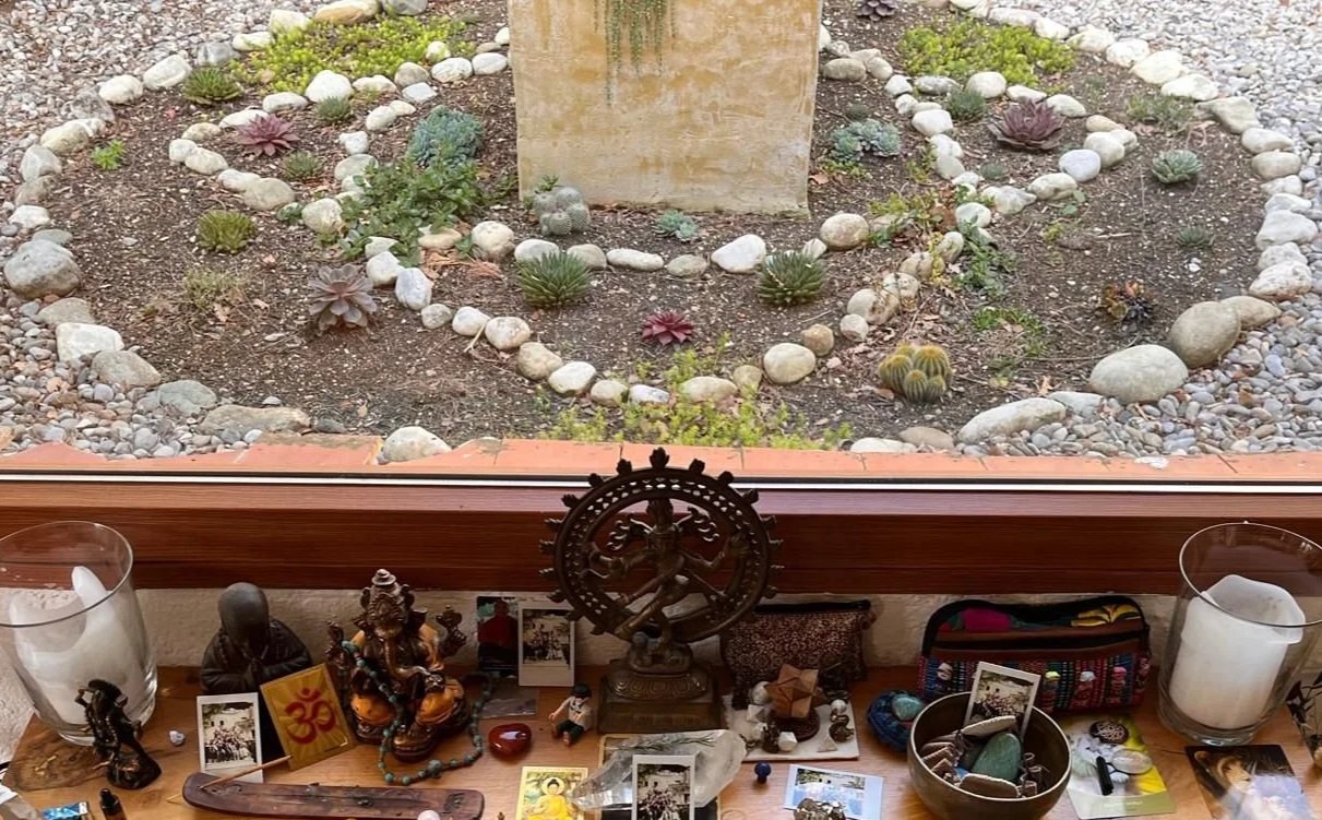 Spiritual altar arranged with symbolic objects used for reflection, meditation, and ritual practice, evoking a sense of sacred space and presence.