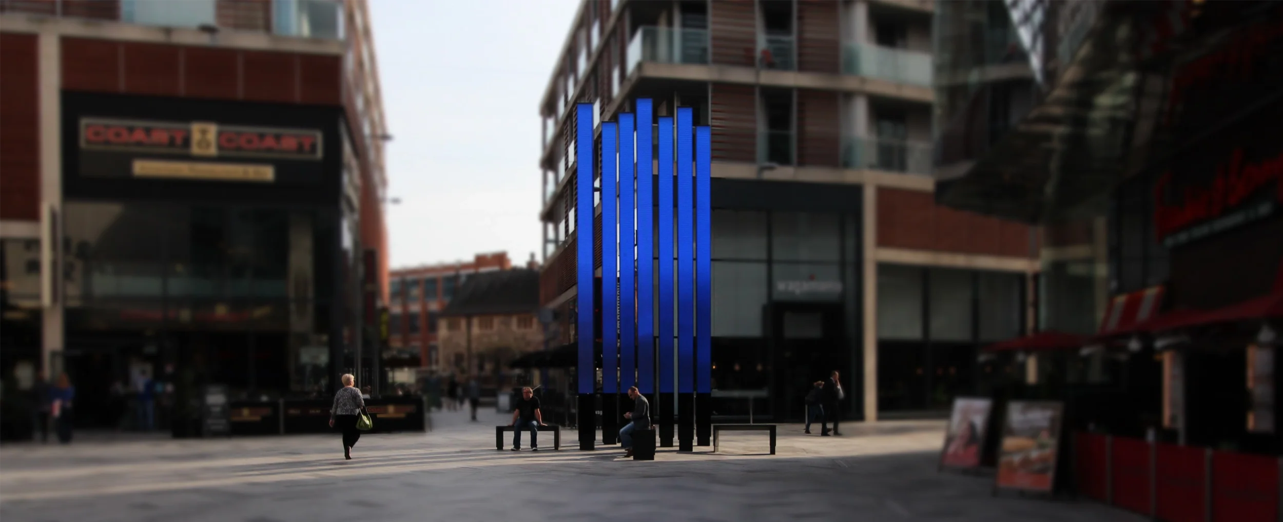Levitate Architects Highcross Beacons Digital Sculpture glowing blue LED totems creating a vibrant digital art installation in the square.