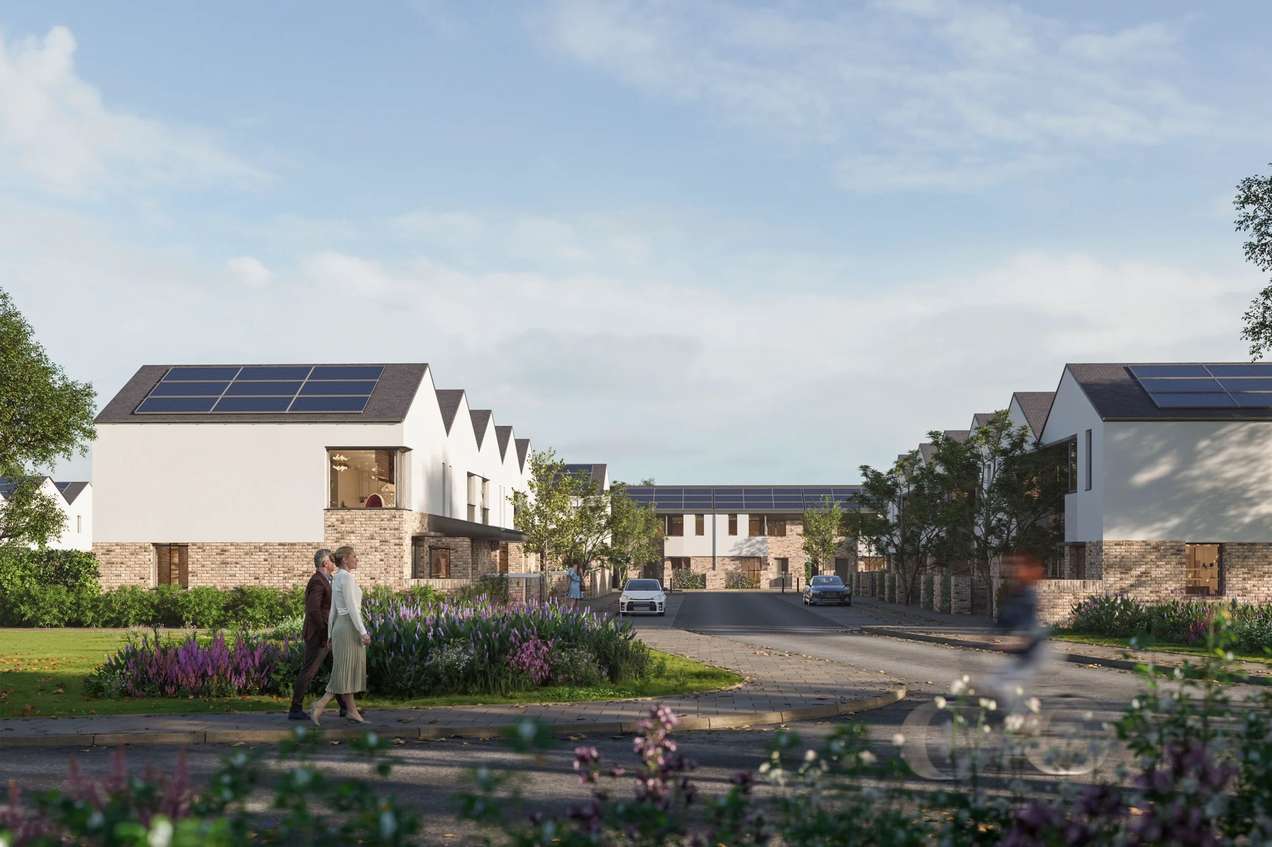 Levitate Architects FLEC Leicester modern housing street scene with solar panels, landscaping, pedestrian path, and central access road.