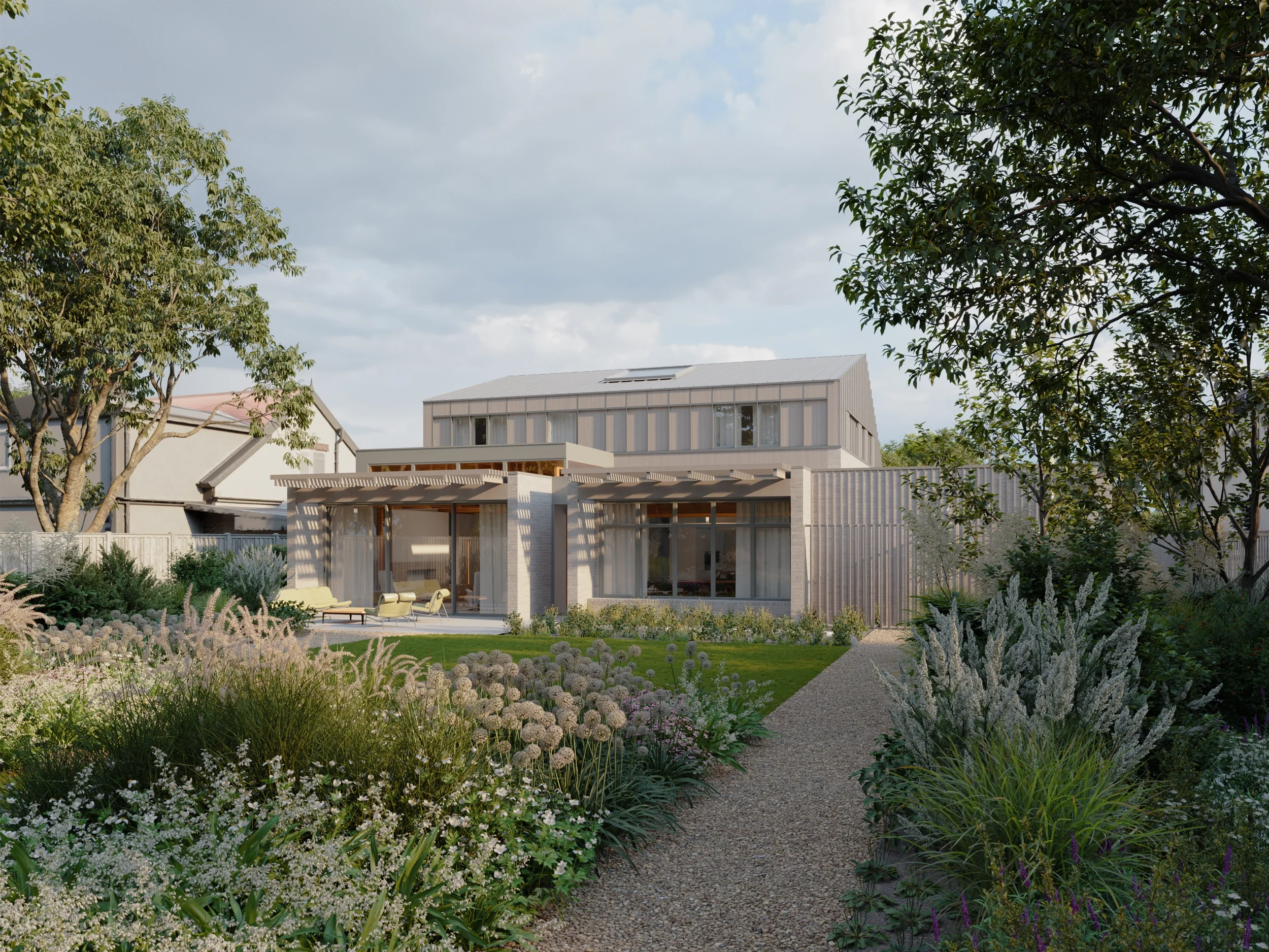 Levitate's new build home Adel, Leeds. South-facing rear facade featuring floor-to-ceiling glazing, stone facade, and biodiverse landscaping.