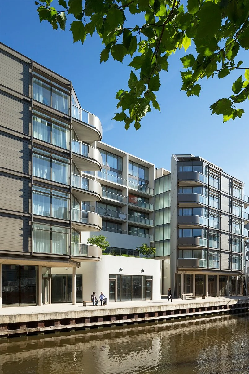Waterfront view of Nottingham One by Levitate Architects, featuring modern housing blocks and urban regeneration along the canal towpath.