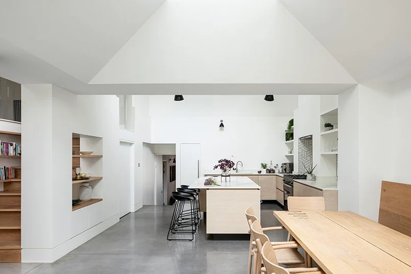 Levitate Architects Gloucester Drive contemporary kitchen and dining extension with vaulted ceiling, skylight, and natural timber finishes.