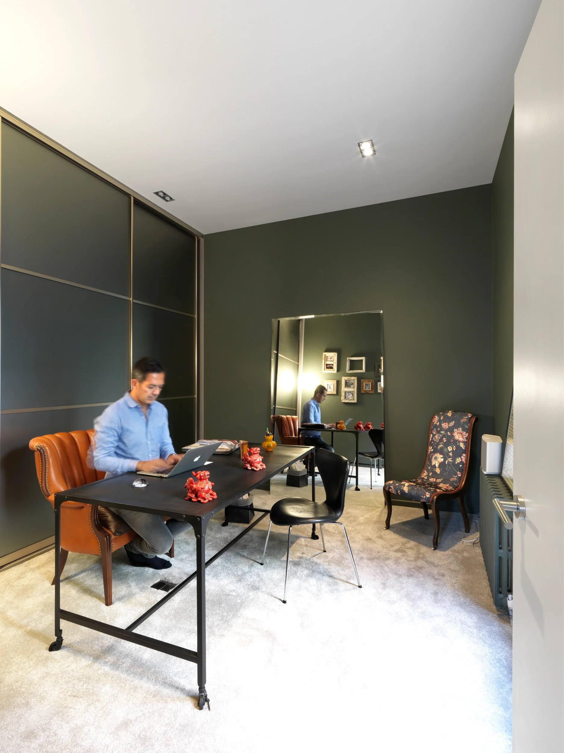 Levitate's London Shoreditch Loft study with dark teal feature wall and built in storage