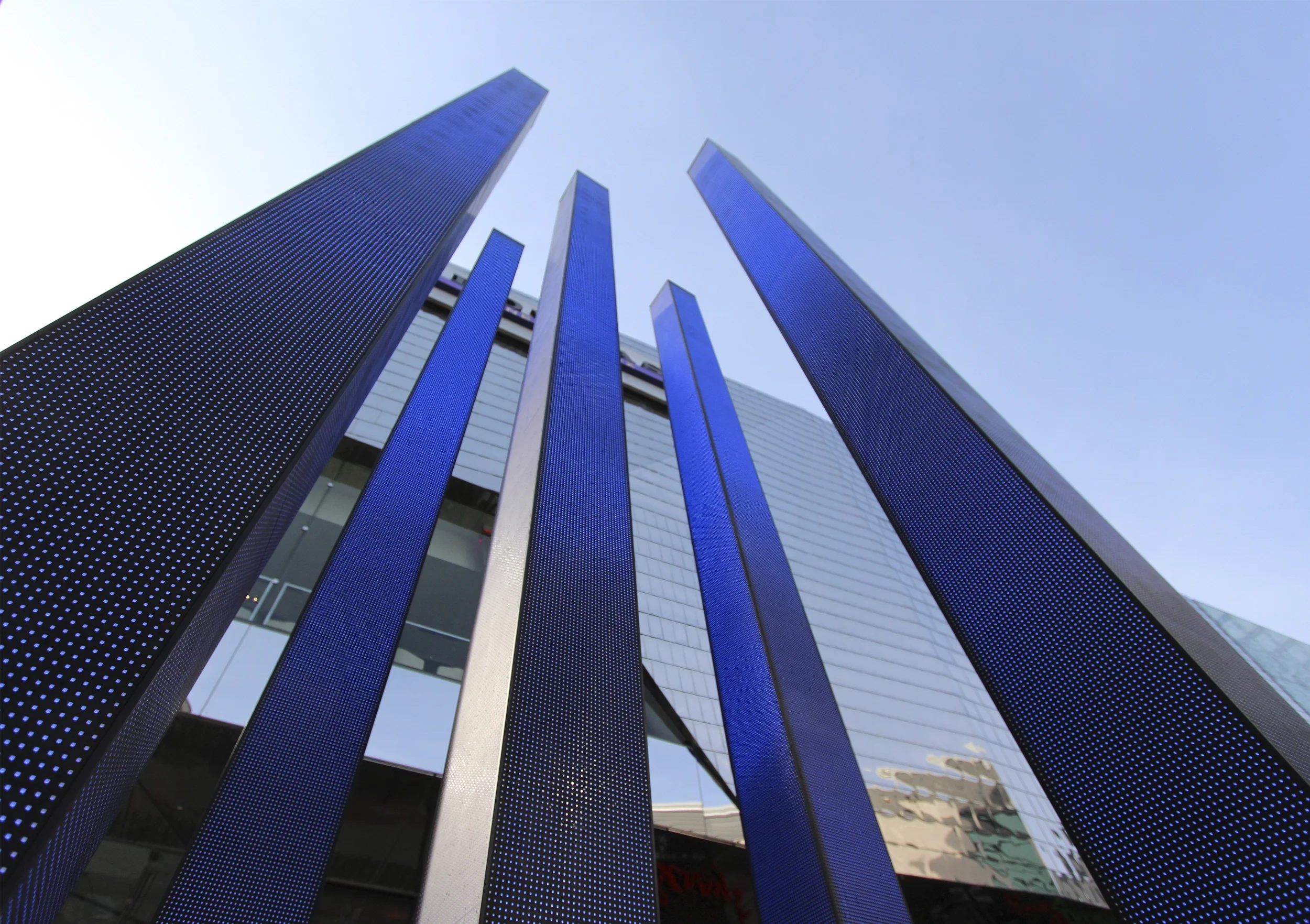 Levitate Architects Highcross Beacons Digital Sculpture low-angle view of vertical LED screen columns showing blue digital technology.