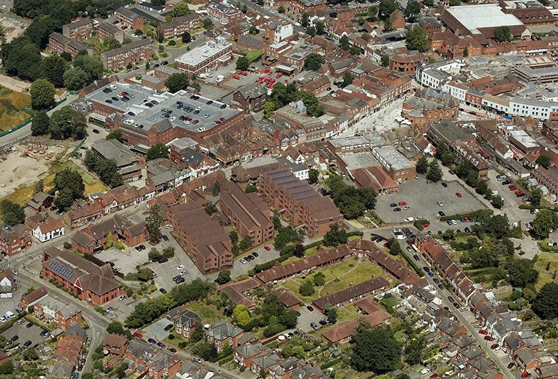 Levitate's Wokingham Centre Development aerial view showing The Courtyard's linear brick buildings set within the town centre's rooftops