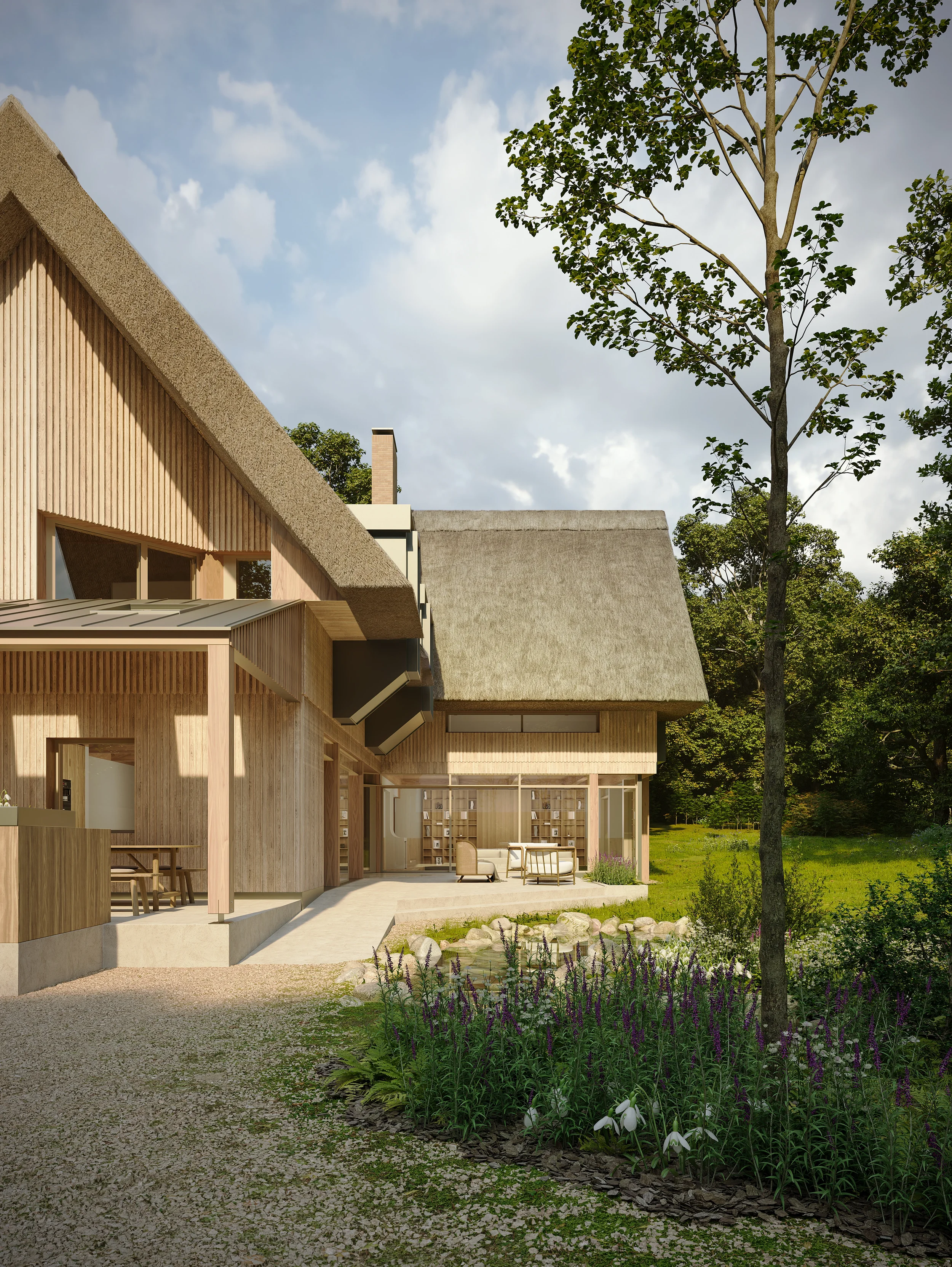 Levitate Architects House in a Field thatch and timber exterior showing natural materials and open courtyard blending with conservation area setting.