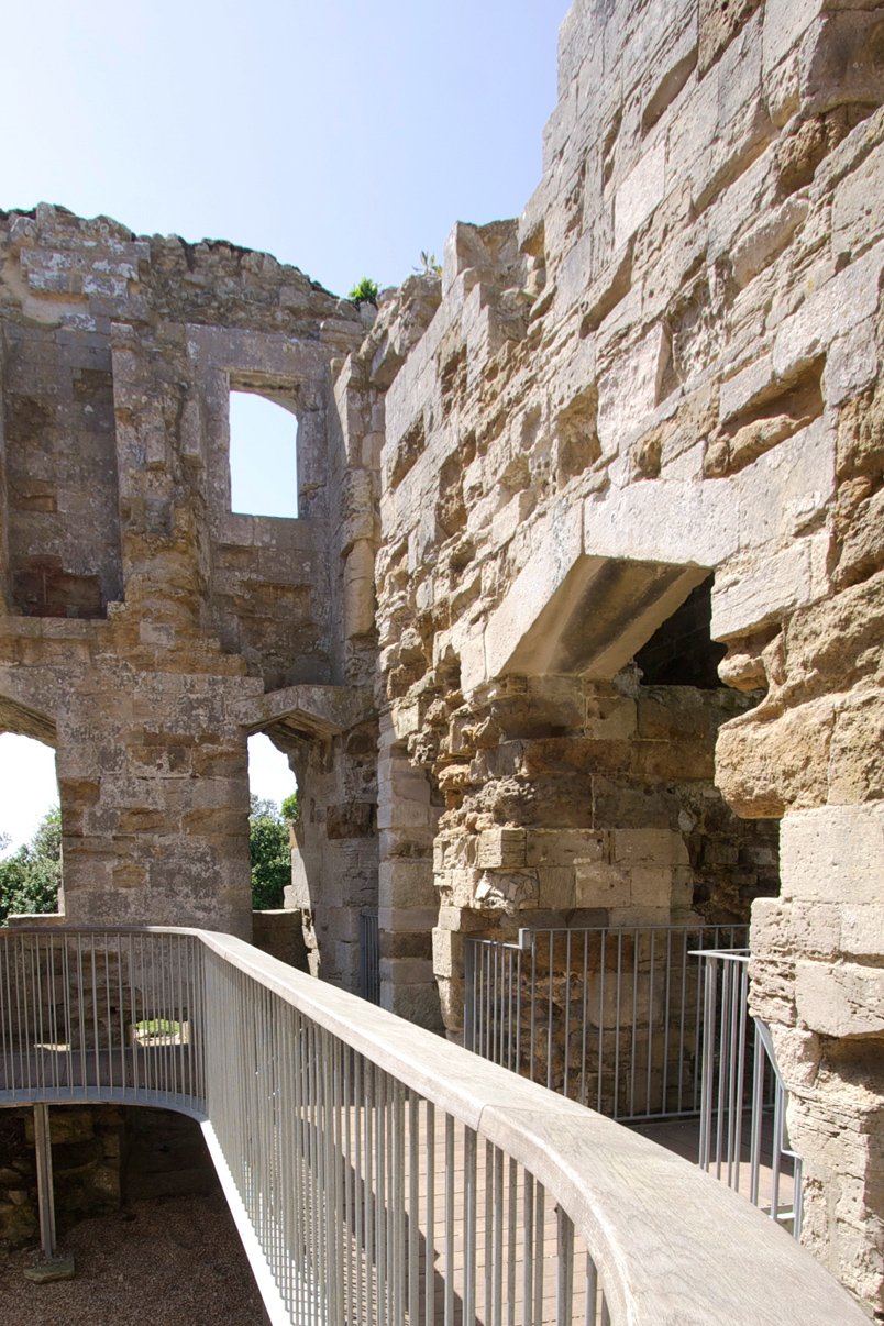 Award Winning Levitate Architects' Sandsfoot low-angle shot shows crisp metal balustrades protecting the irregular, historic masonry openings.