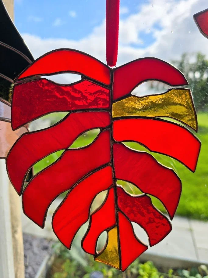 The stained glass monstera leaf in autumnal colours