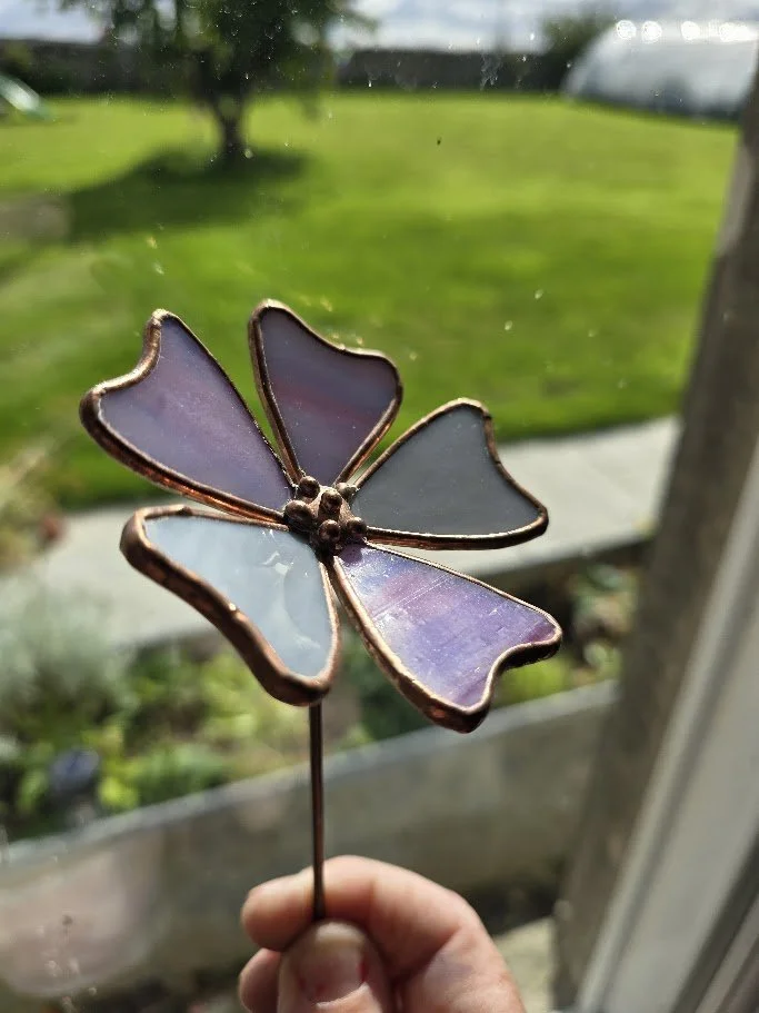 A 3d stained glass flower with beaded solder detail