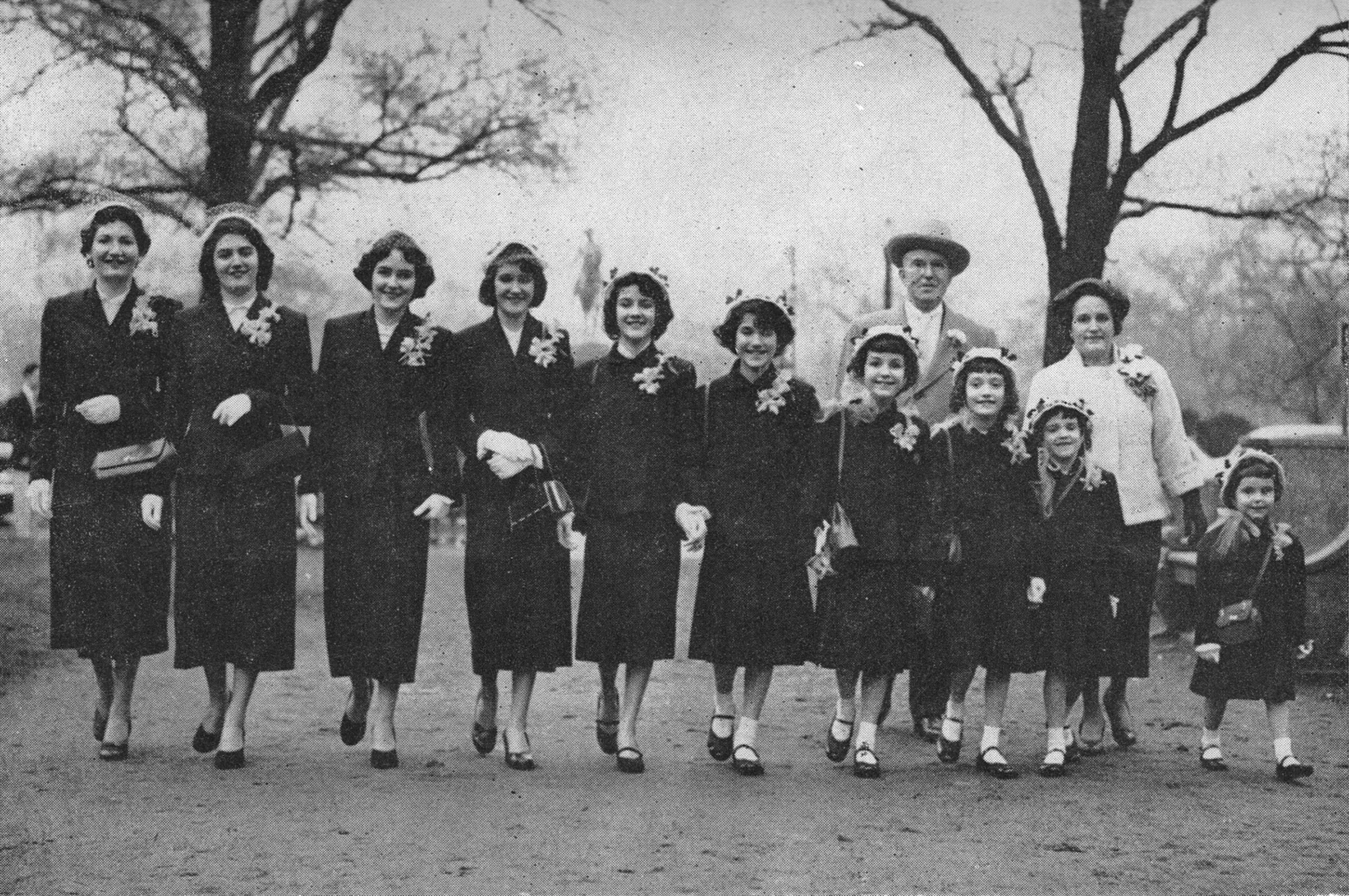 l to r: Jane, Barbara, Diane, Maureen, Evelyn, Ginny, Mary June, Julie, Danielle, and Fran. Dan and Julia behind. Photo: Boston Globe 1953.