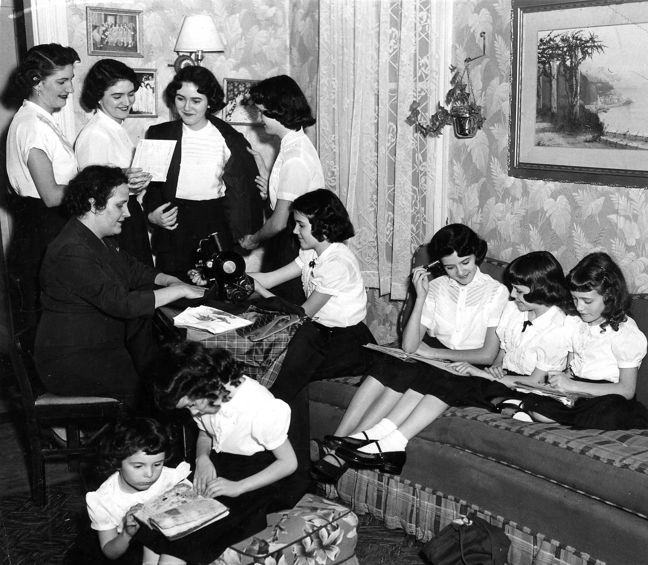 Photo of Sister's helping mama prepare for Easter parade. Photo by Nina Leen, Life Magazine.