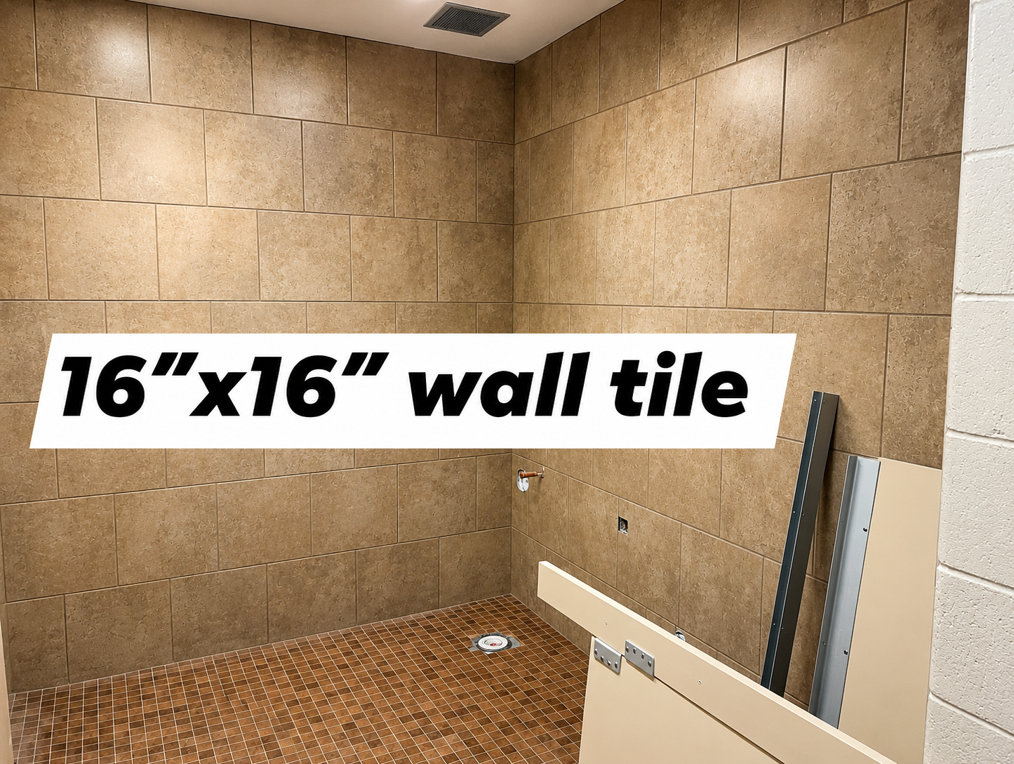 An empty shower area with beige wall tiles, brown floor tiles, a drain, a wall fixture, and metal framing parts leaning against the wall.