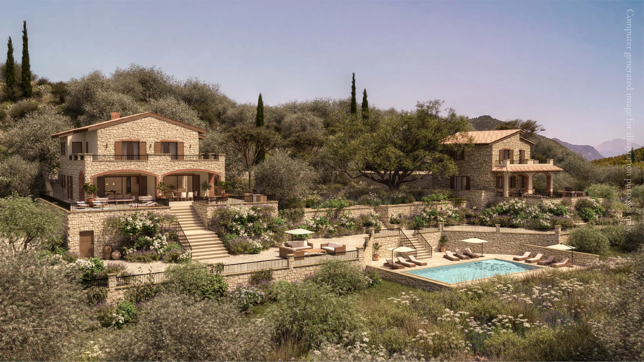 A hillside with two stone houses, each with balconies and brown shutters, surrounded by trees and lush greenery. There is a swimming pool with lounge chairs and umbrellas in the foreground, and mountains in the background under a clear sky.