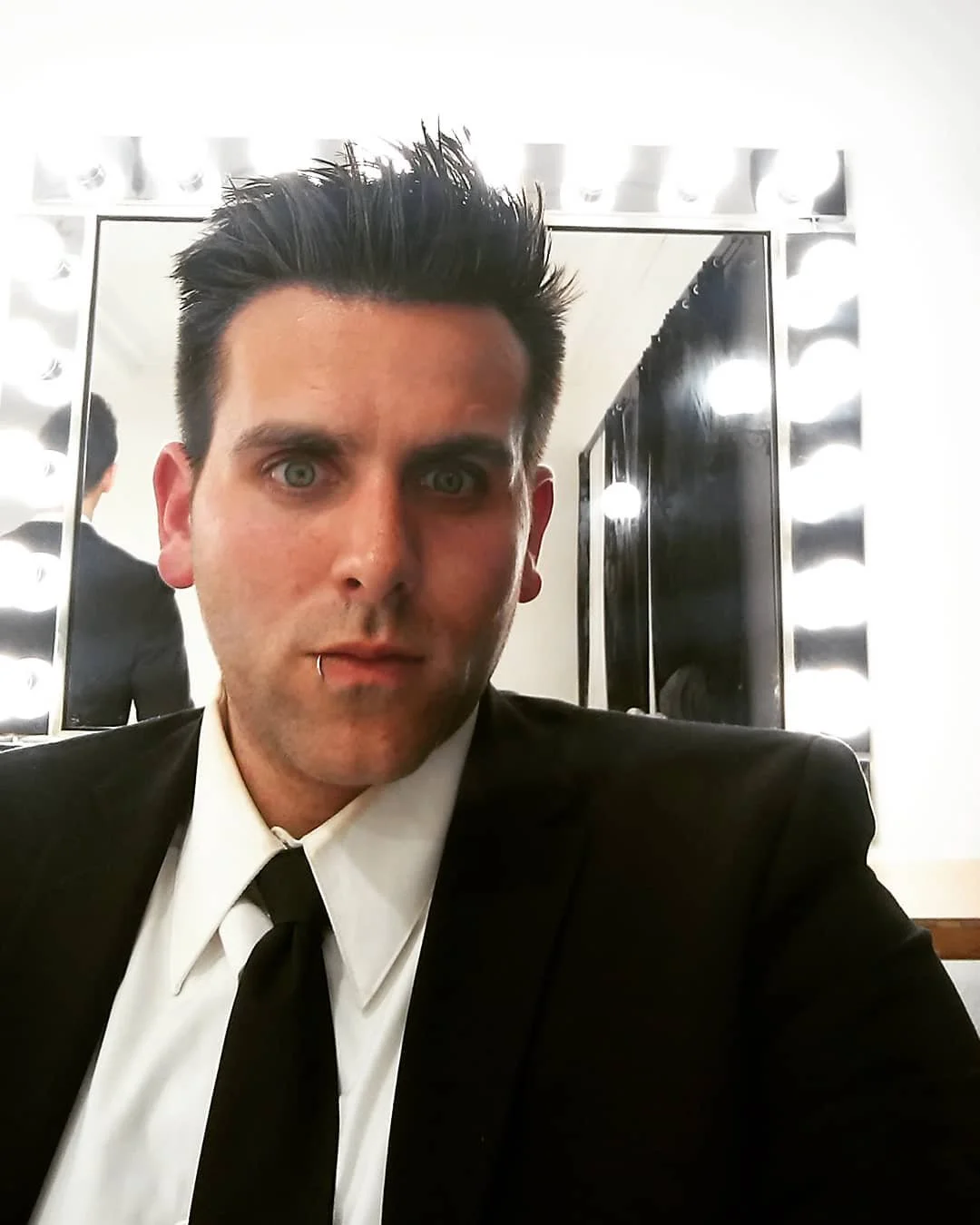 suit in front of mirror.jpg