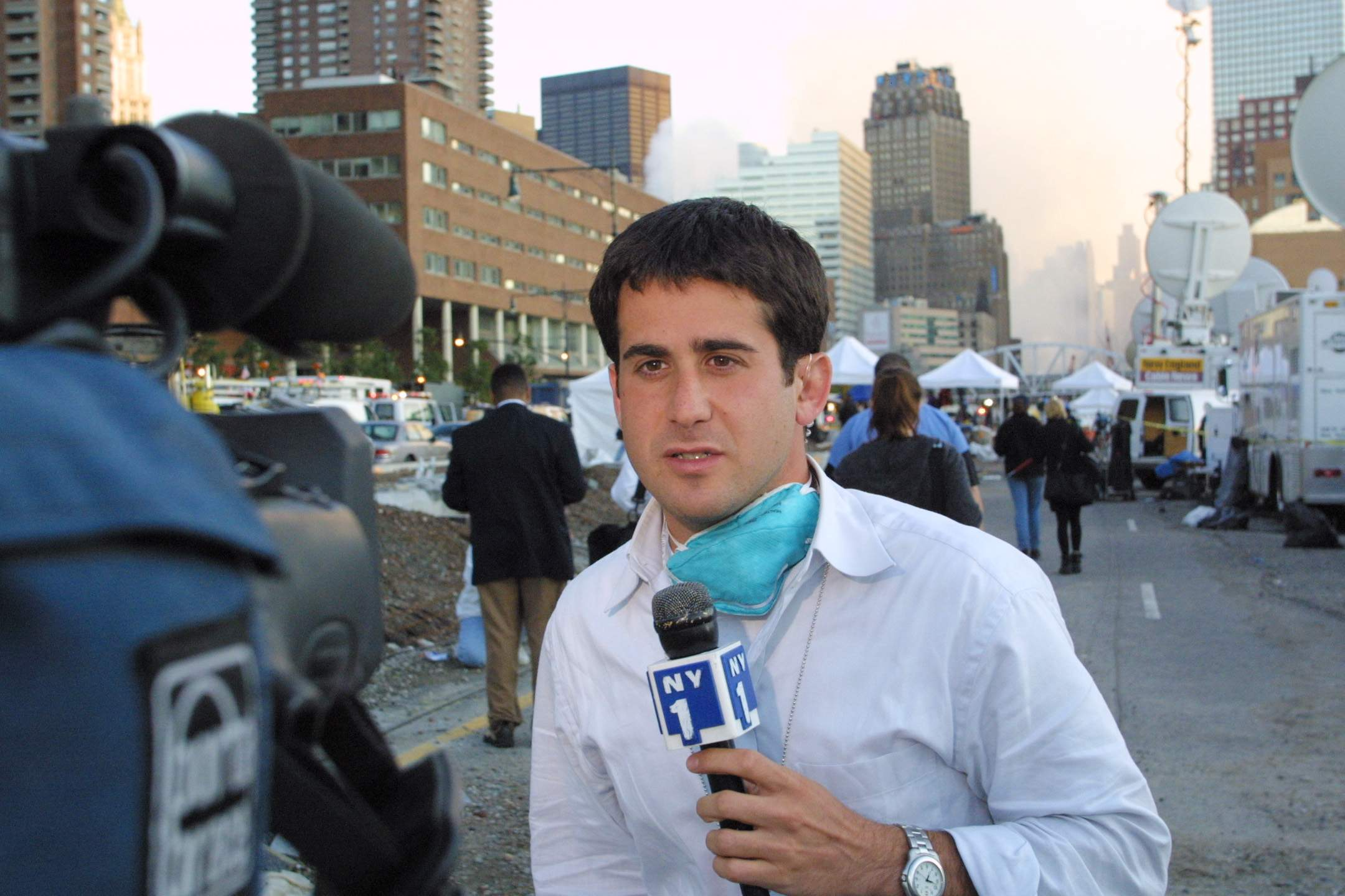 A journalist named John Schiumo reports for NY1 News in the aftermath of 9/11.