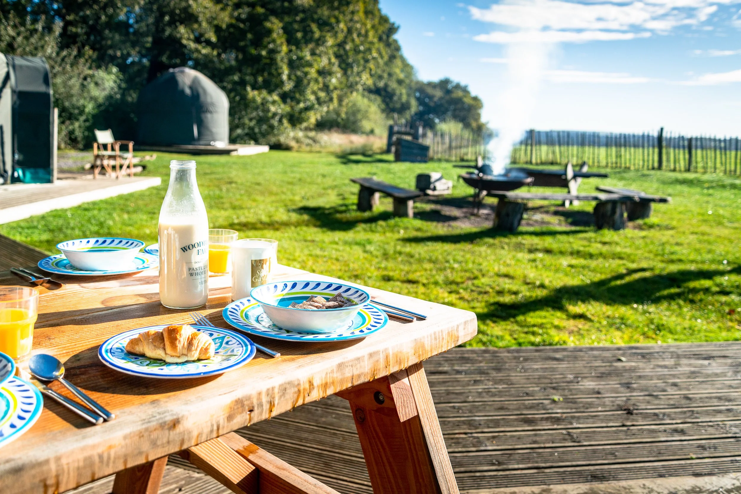 glamping-breakfast-table-detail.jpg
Breakfast table detail at Stock Gaylard glamping site, with outdoor seating, tableware and yurts in the background.