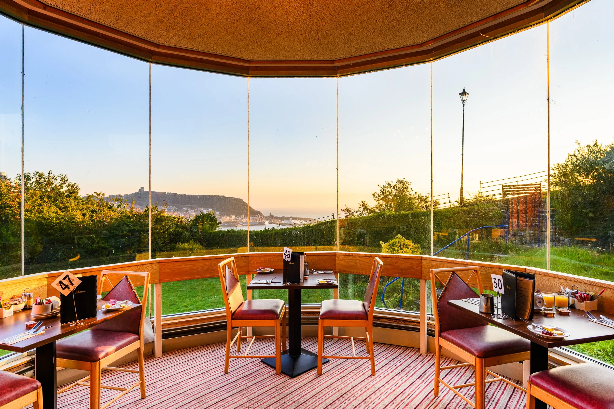 Dining area at the Esplanade Hotel with panoramic views across Scarborough South Bay.