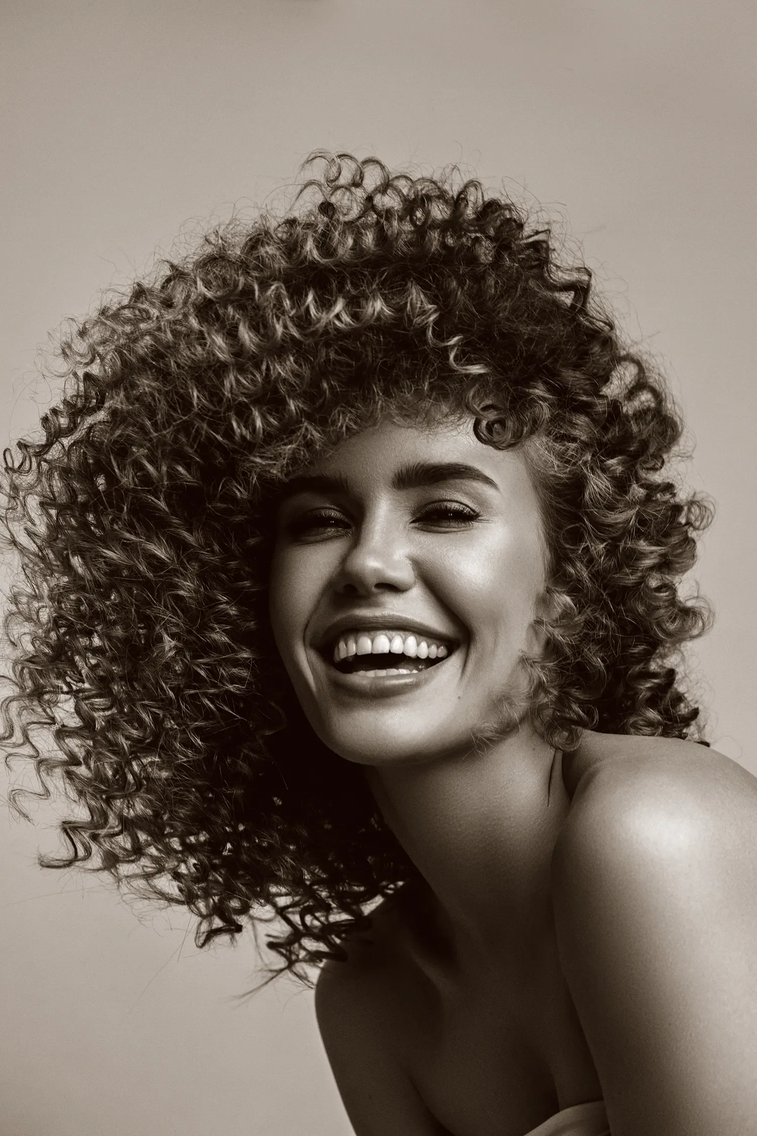 Happy women after having her Afro hair cut and styled at Albert Field Salon close to Reading and Oxfordshire